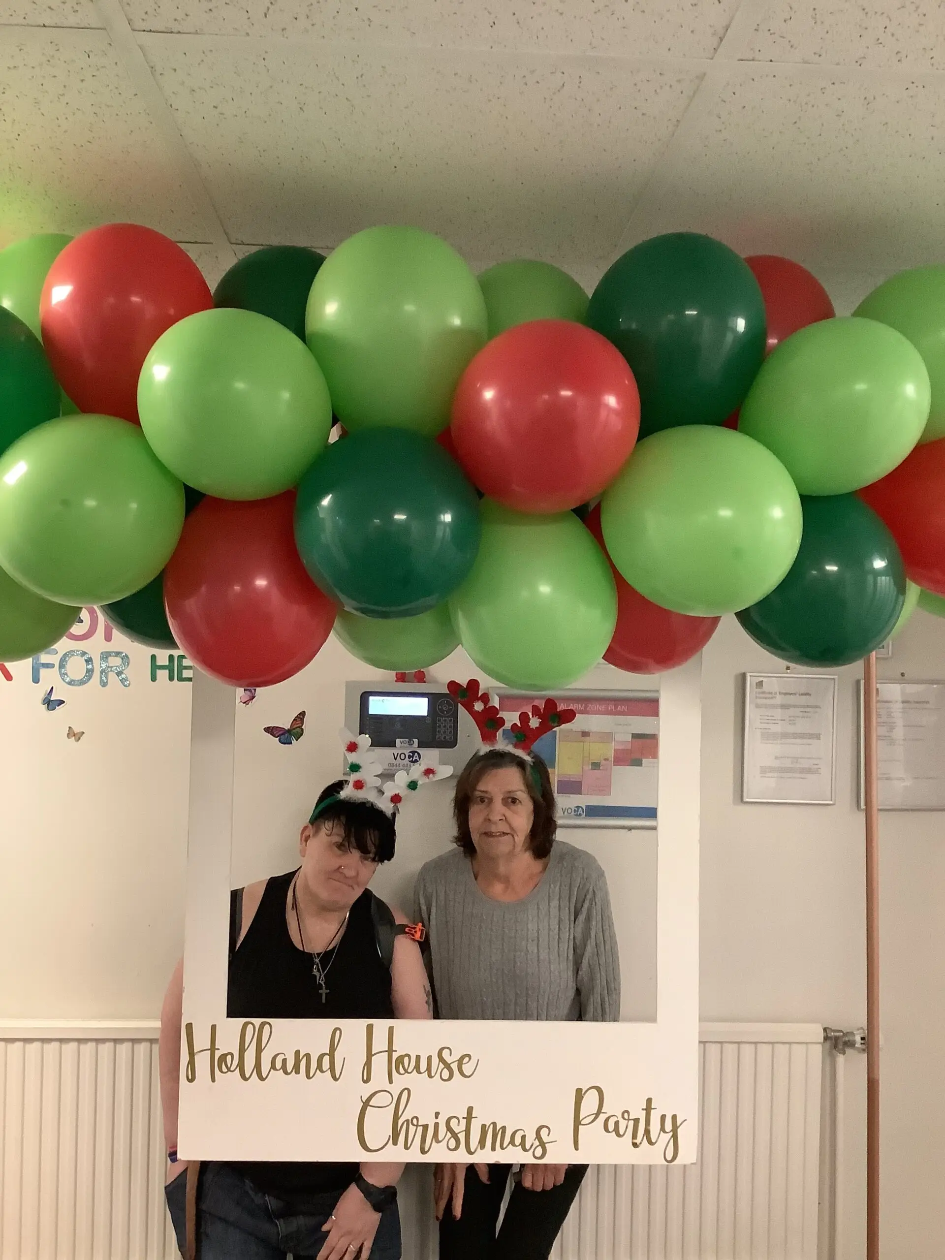residents posing in christmas photo booth
