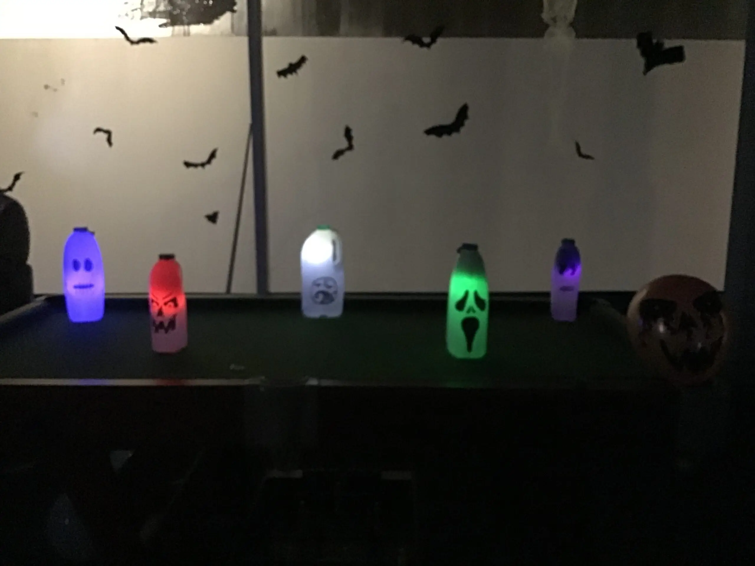 ghosts made from old milk bottles
