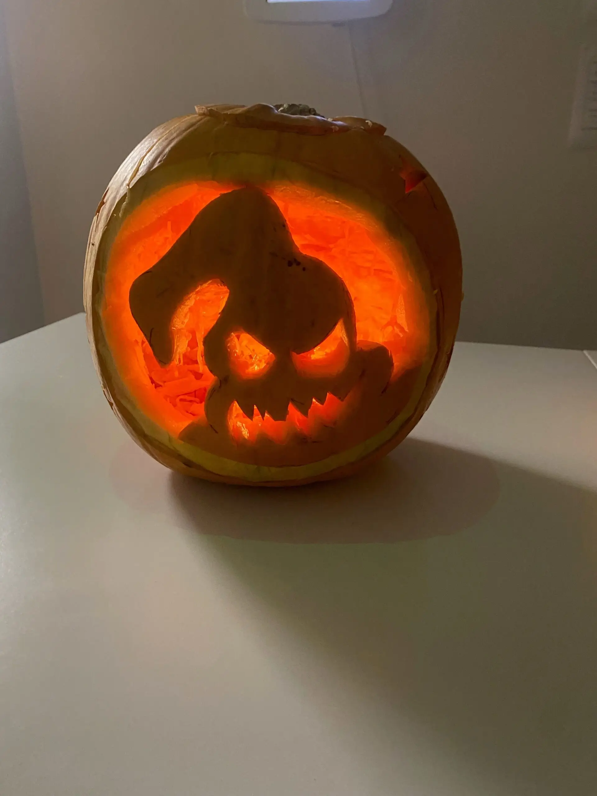 ghost carved into pumpkin