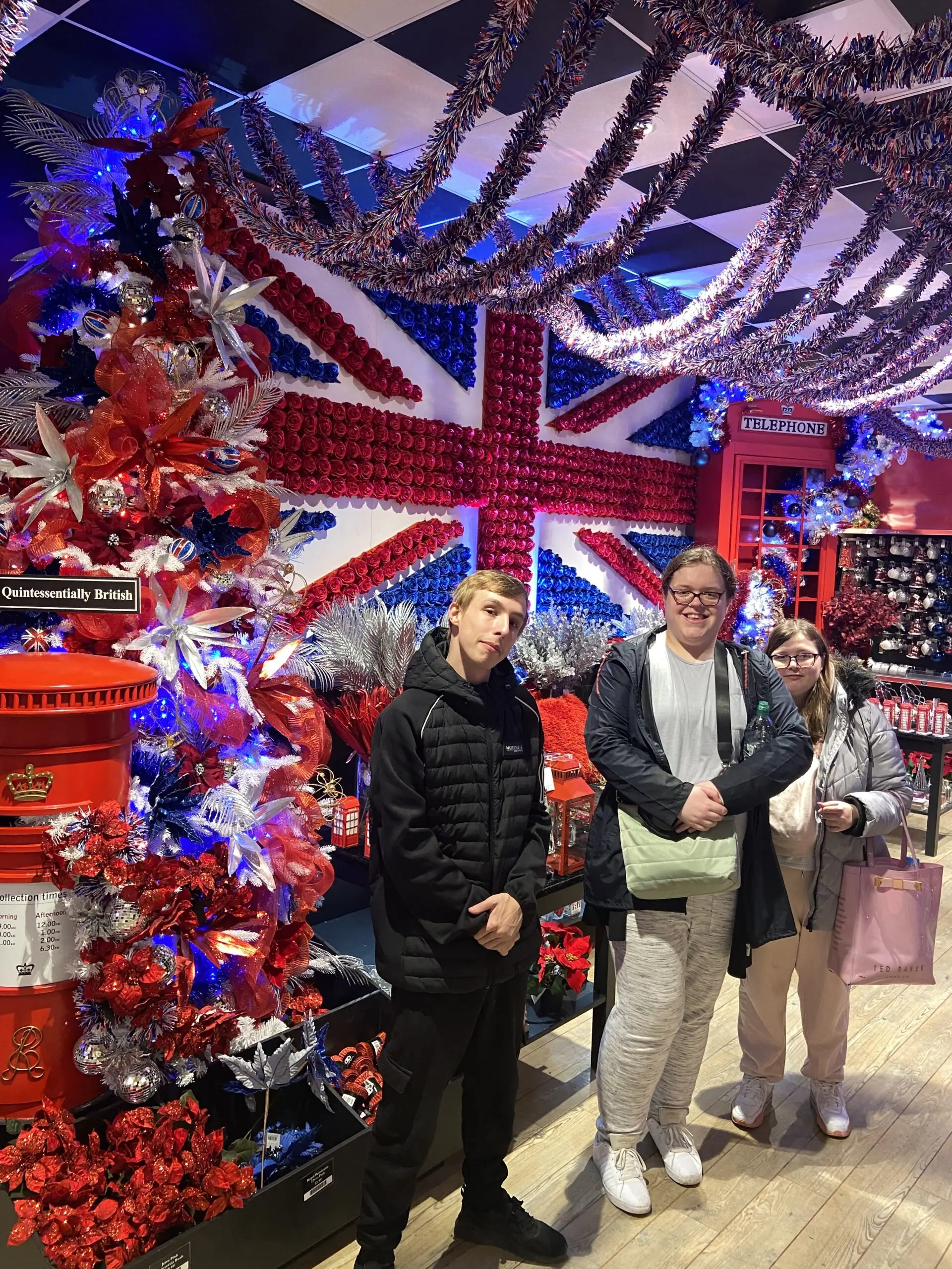 residents standing in front of christmas lights in shape of union jack