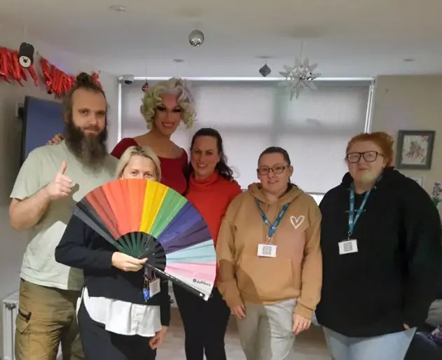 Big Jessie posing with team members
