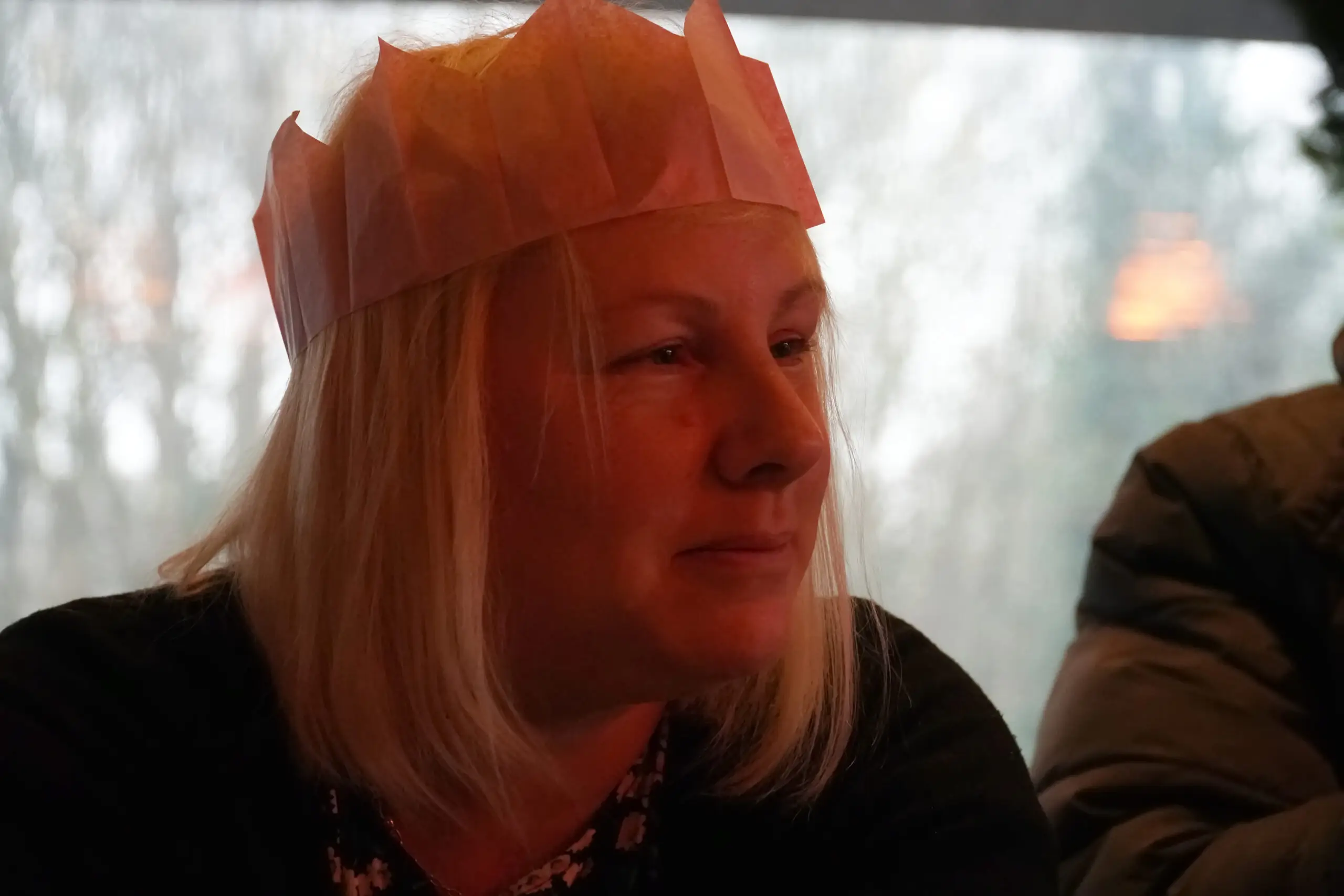 woman in paper party hat