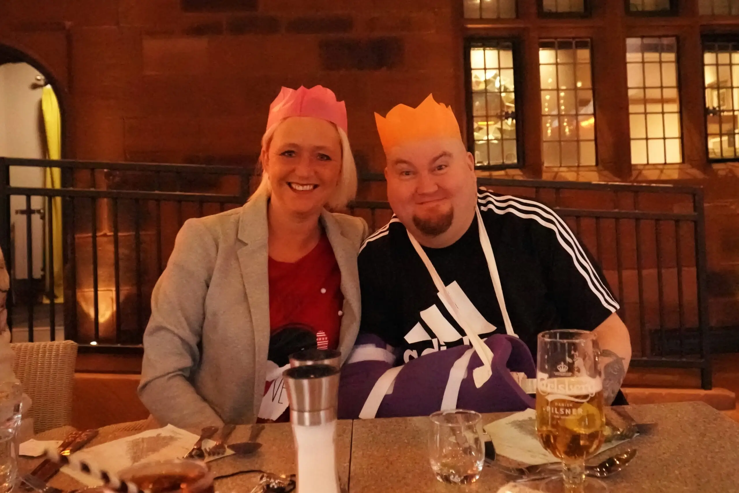 residents in paper party hats