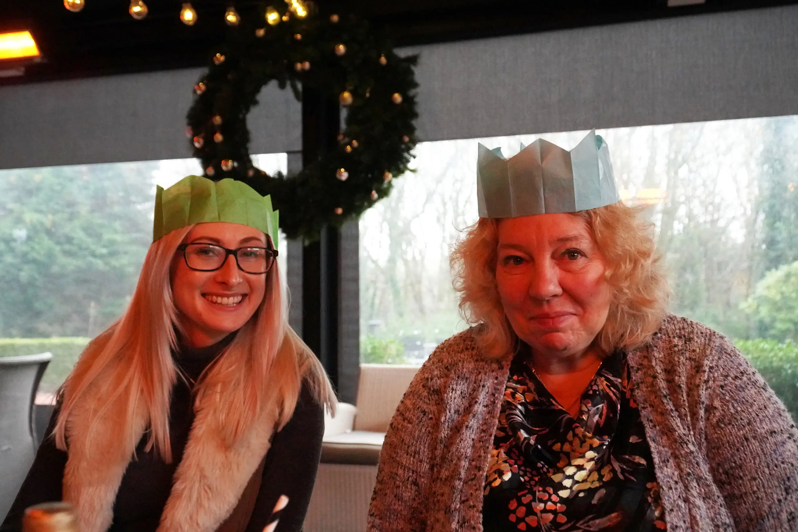 residents and staff in paper party hats