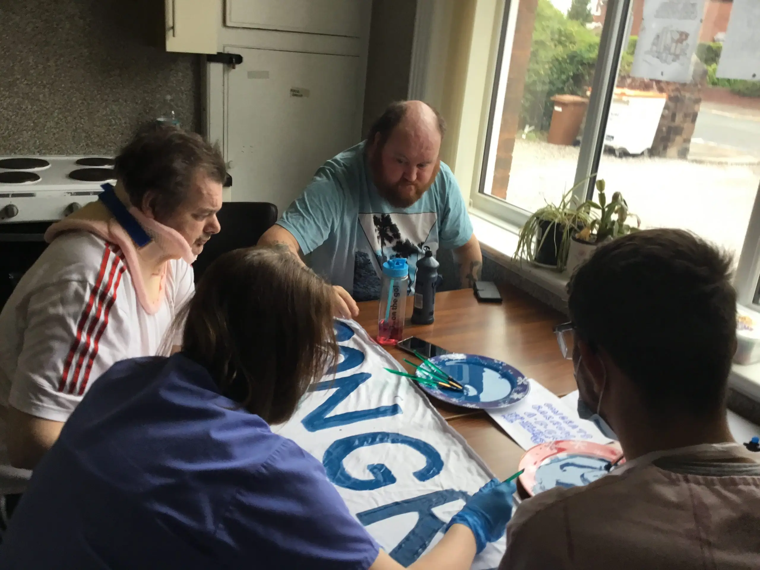 residents painting banner