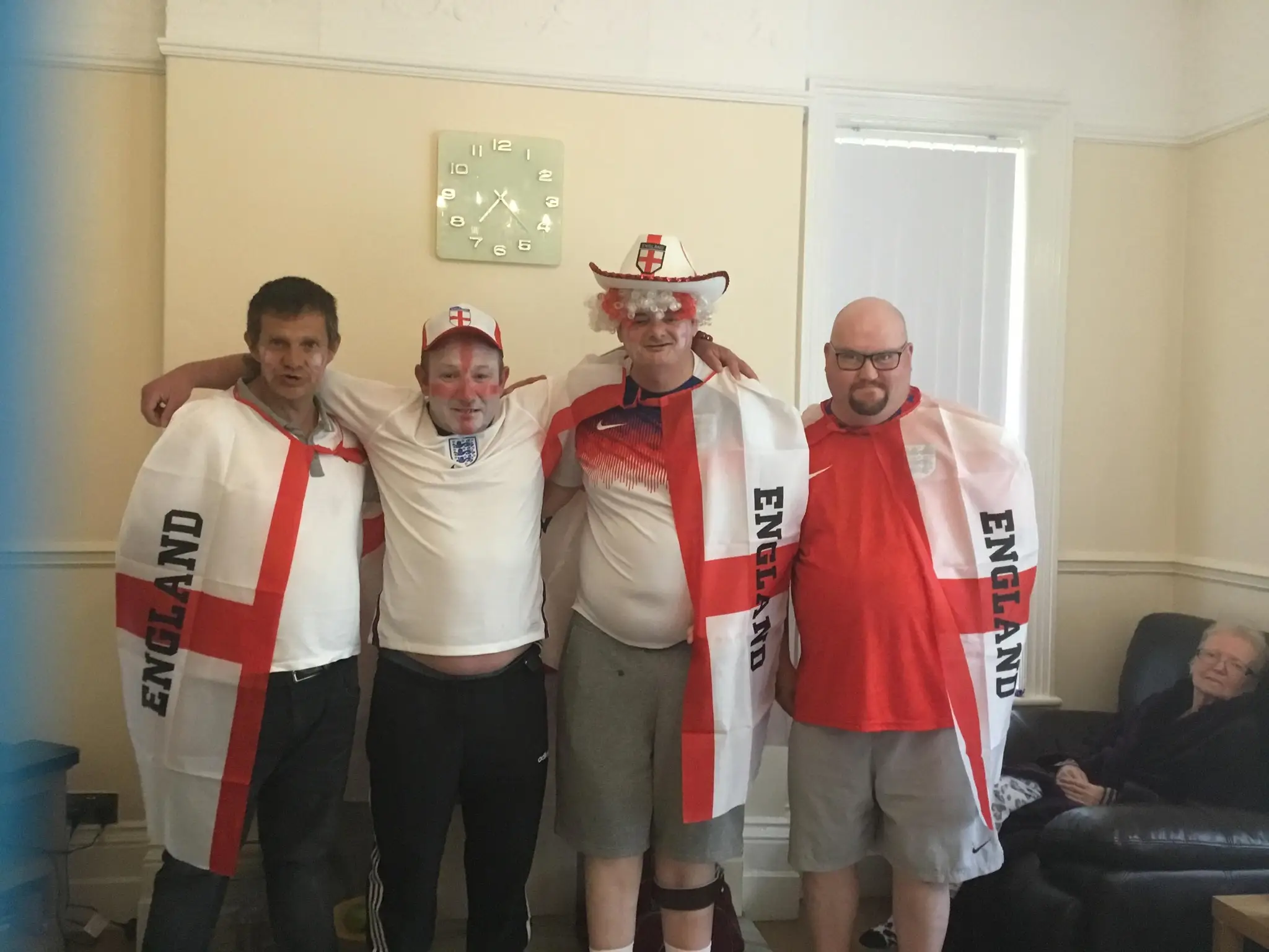 life at Glen Garth: residents dressed in england tops, facepaint and hats