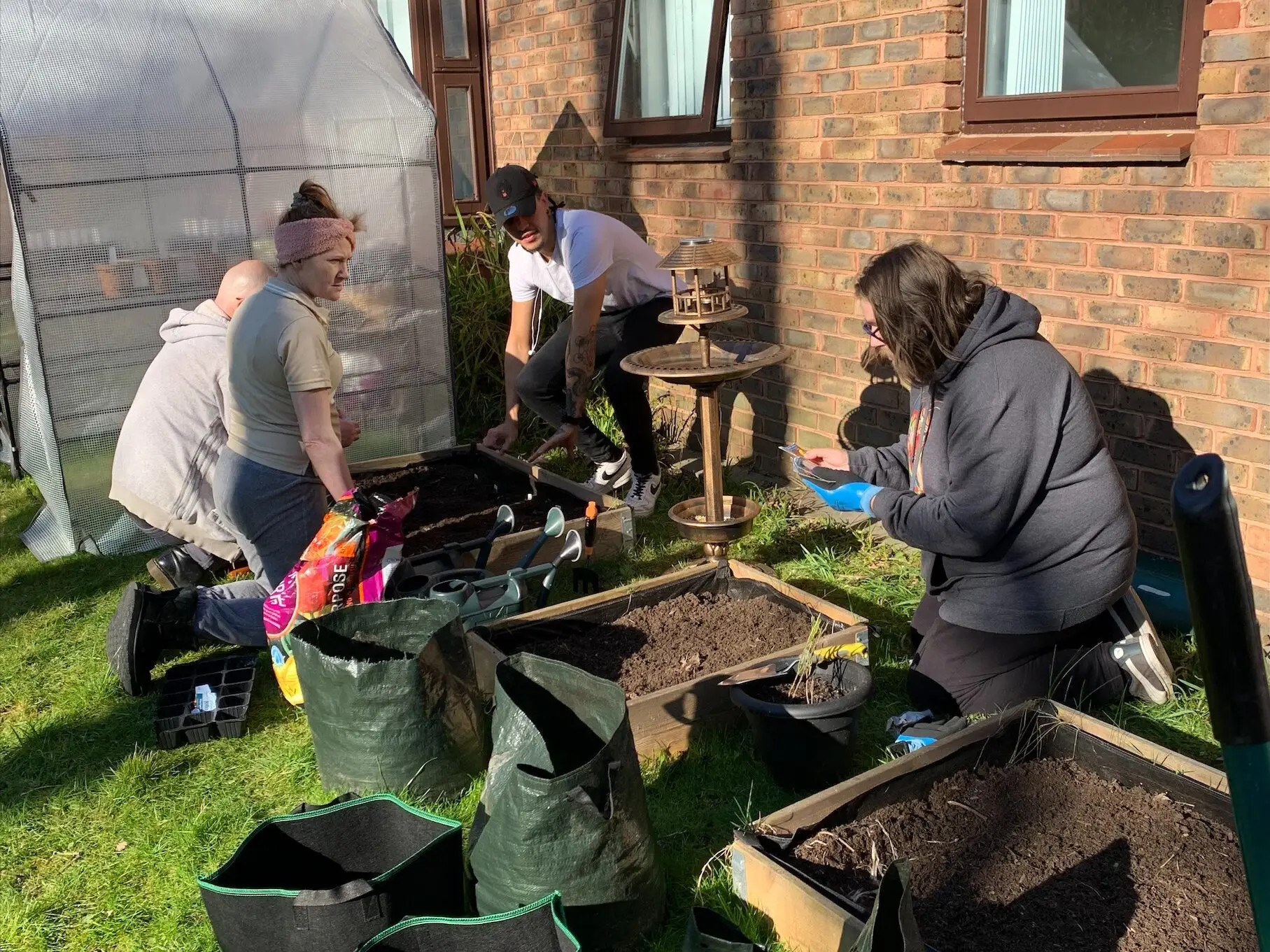 residents gardening in the sun