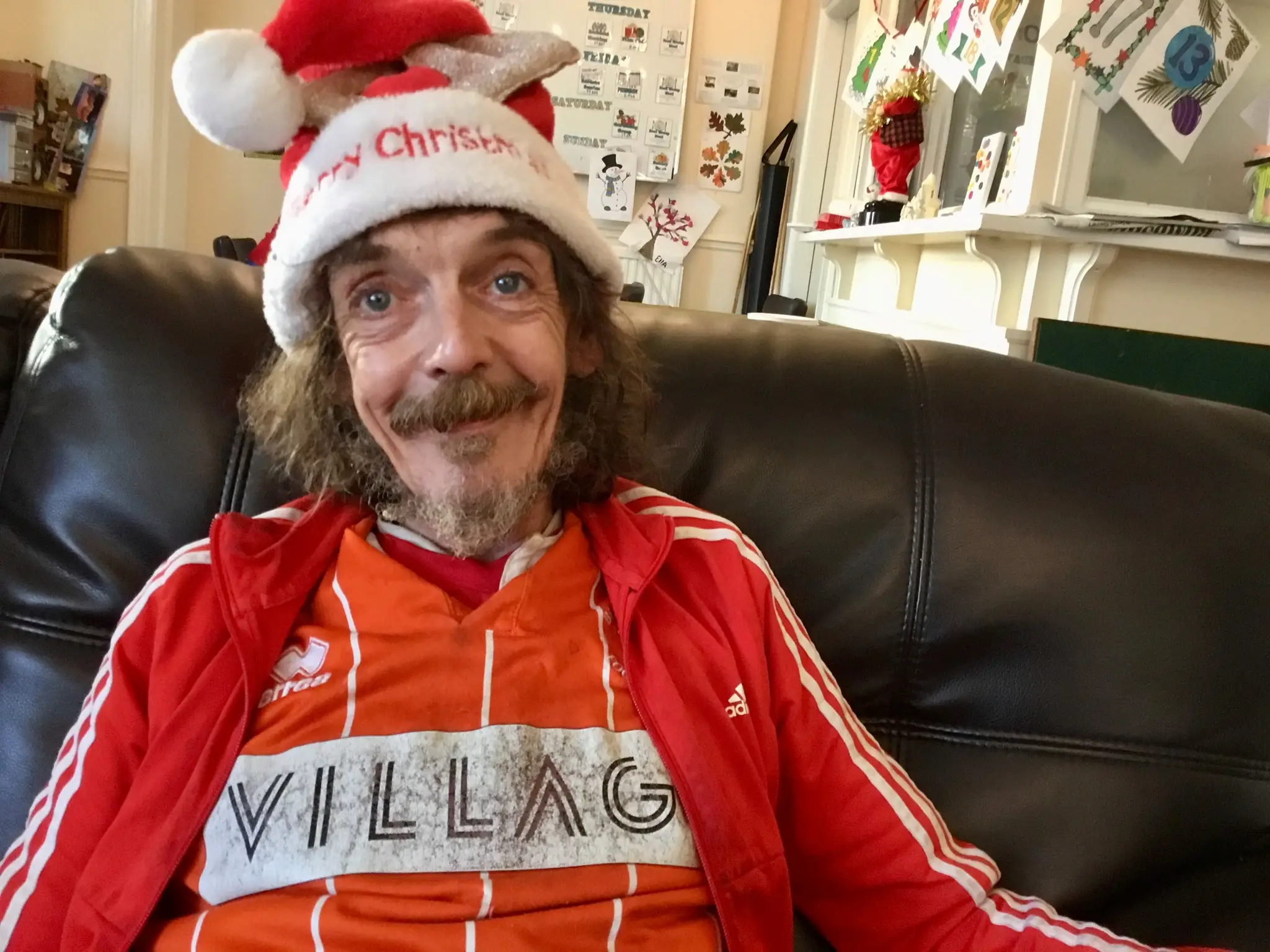 resident wearing christmas hat