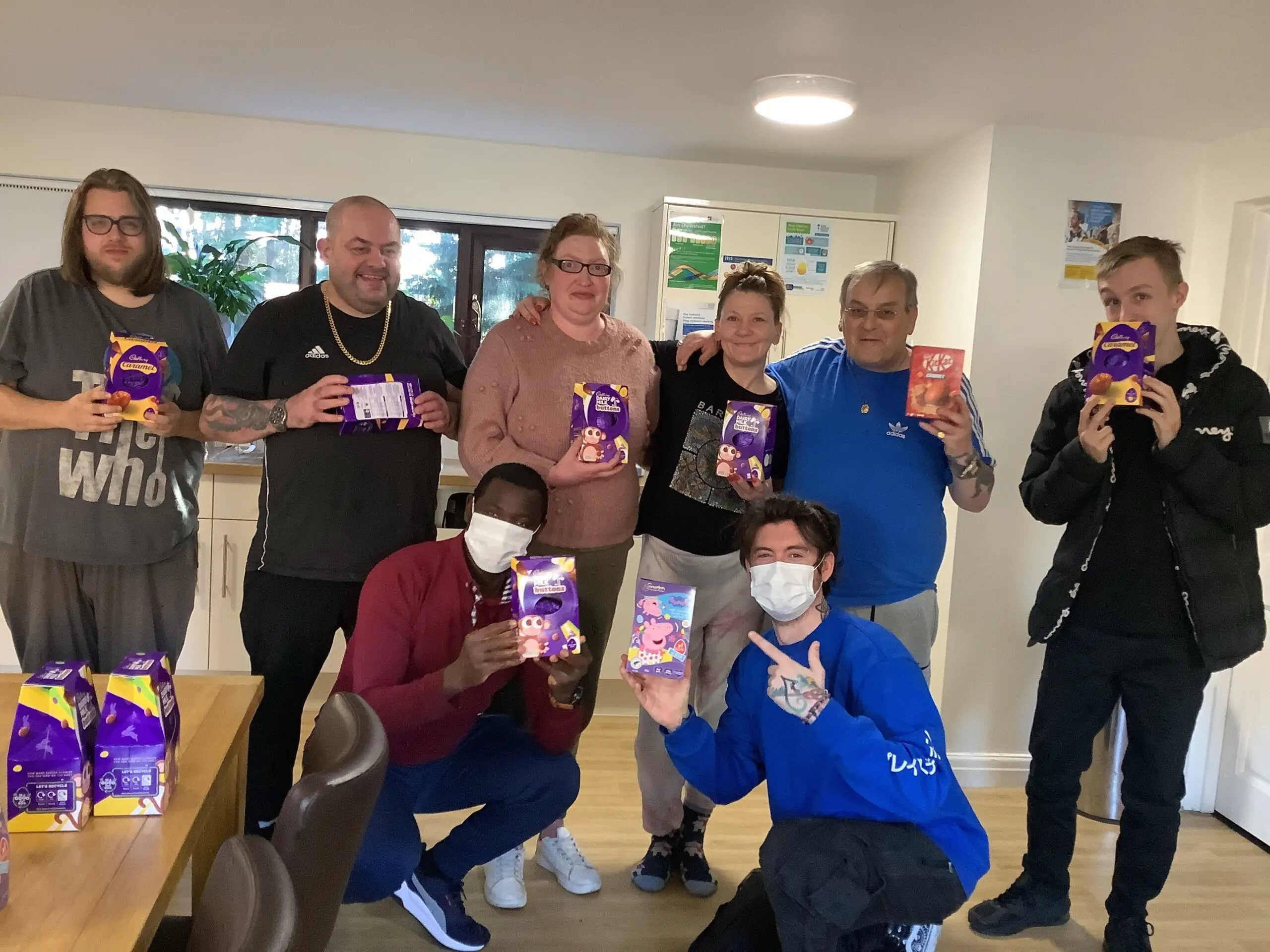 group of residents holding easter eggs