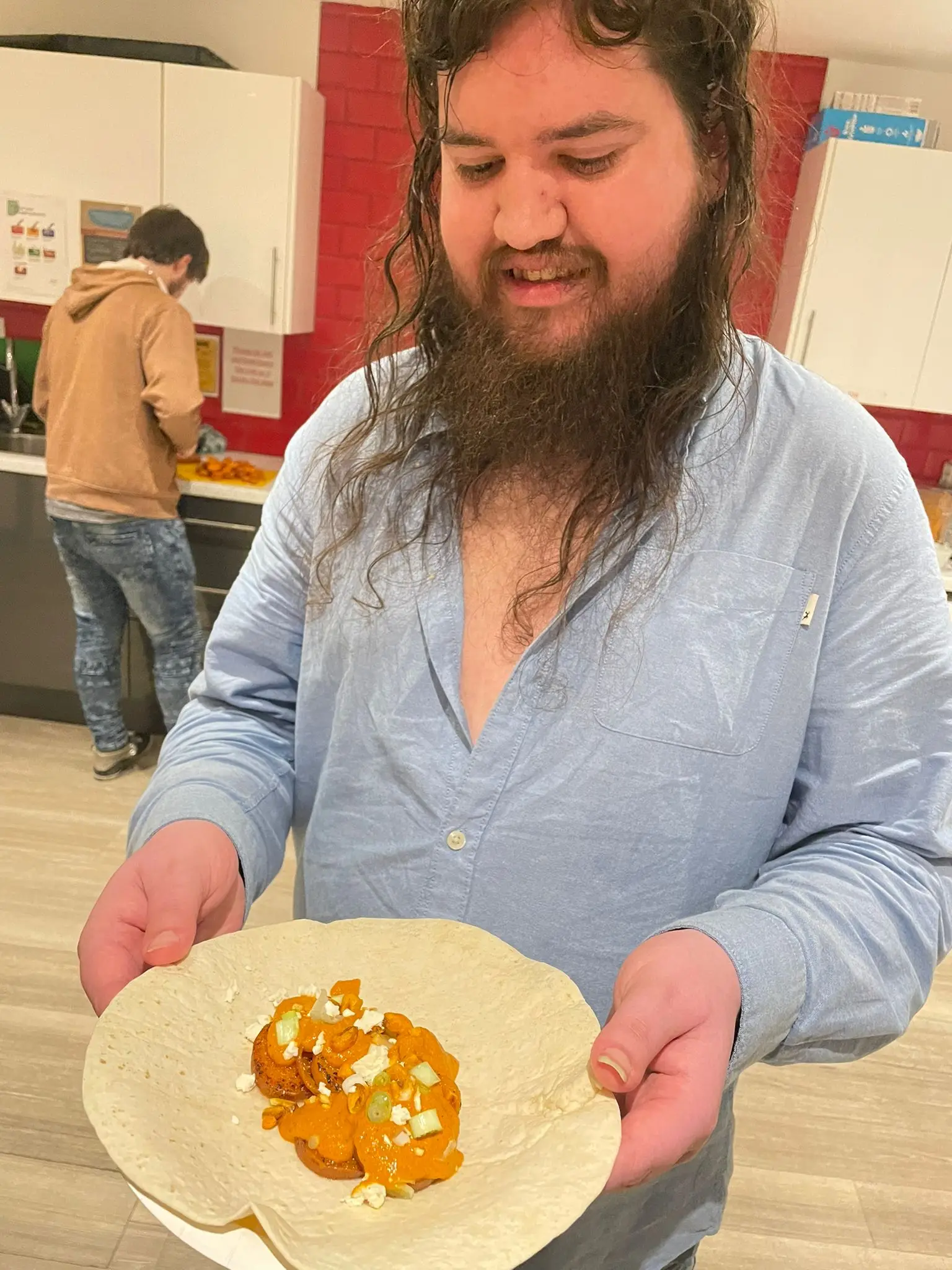 resident holding plate of food