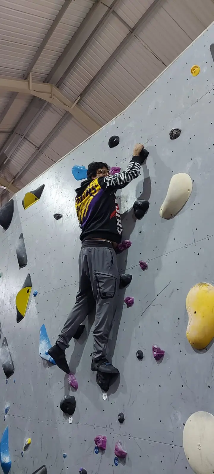 resident on climbing wall