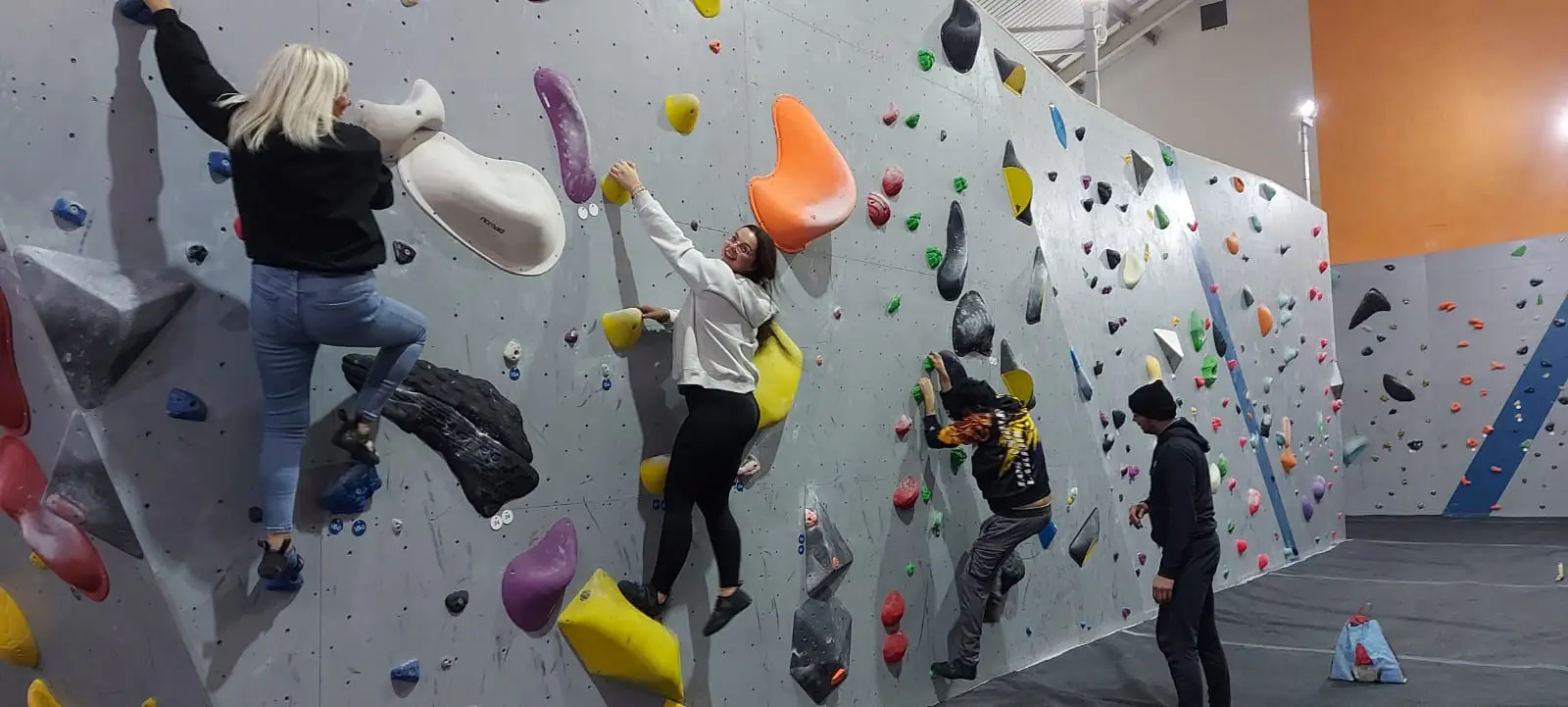 residents on climbing wall
