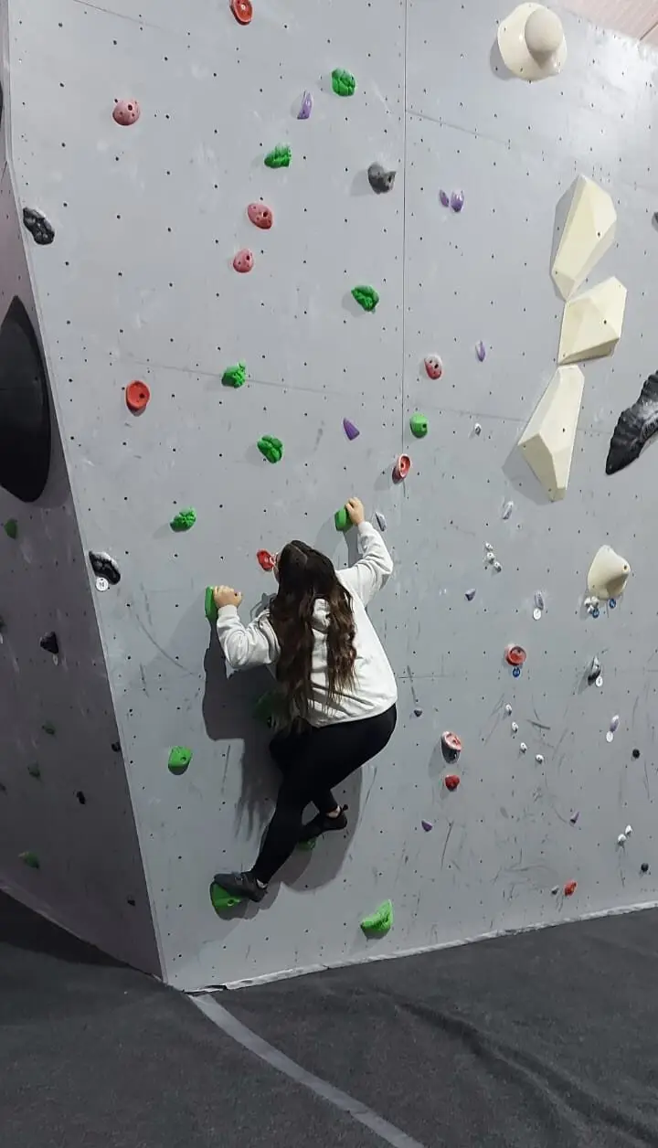 resident on climbing wall