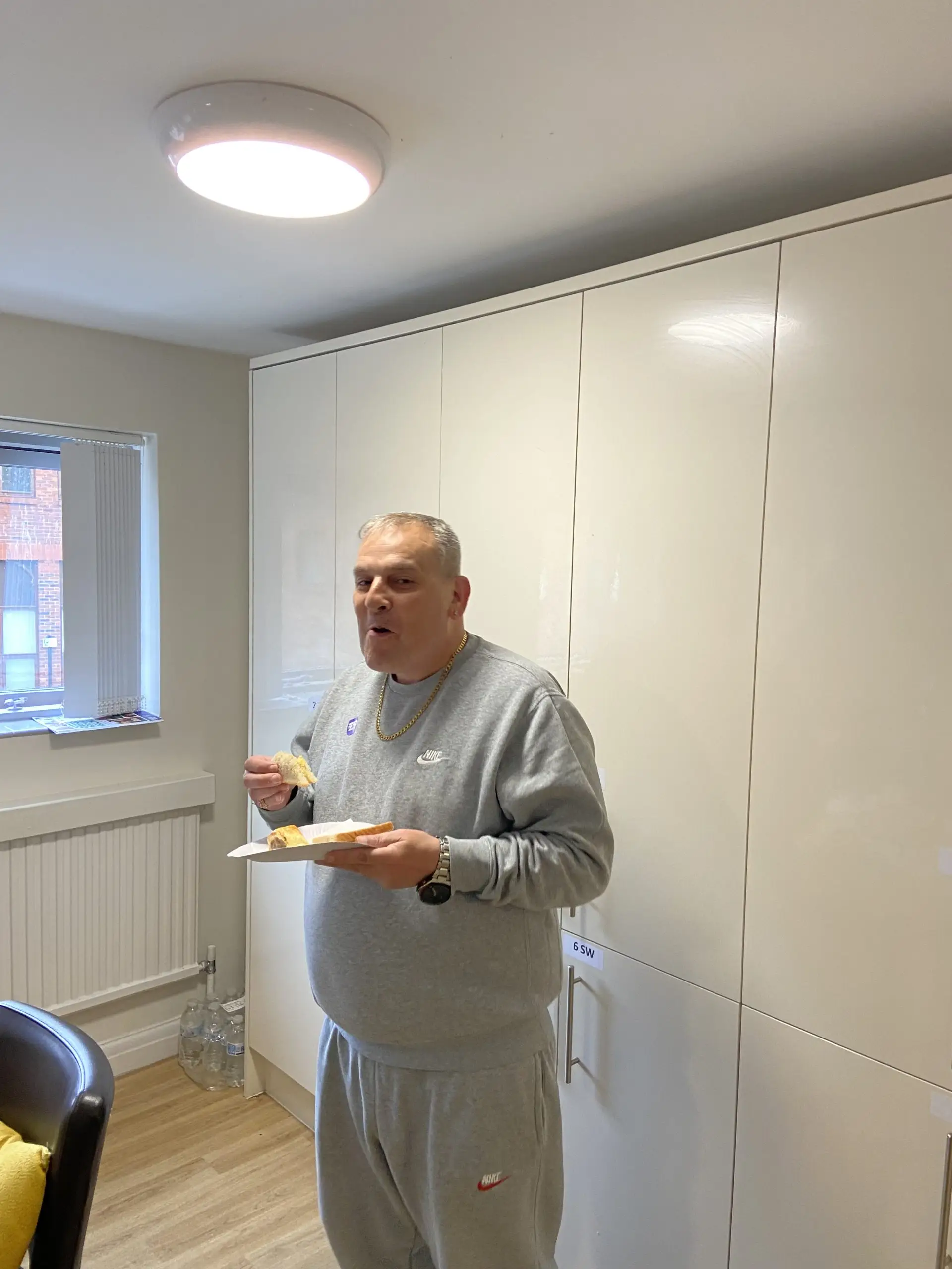Resident enjoying Macmillan coffee morning