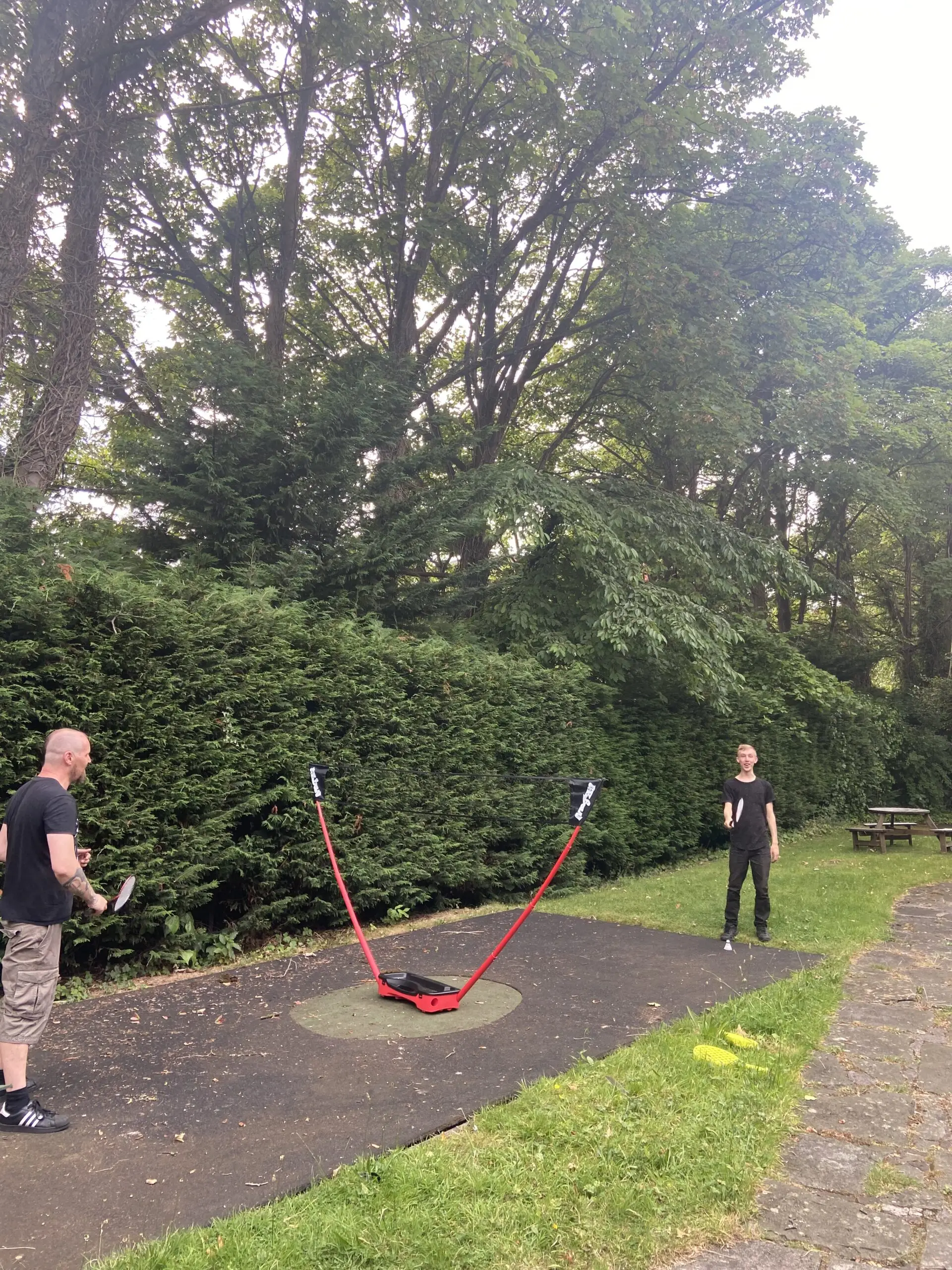 residents playing badminton in the garden