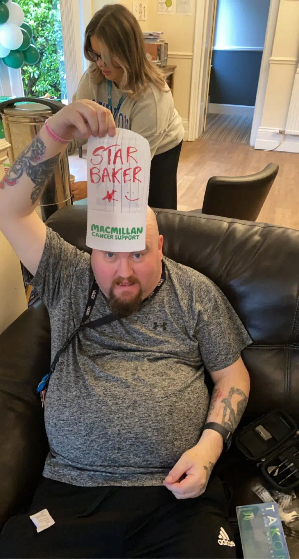resident with paper hat reading "star baker"