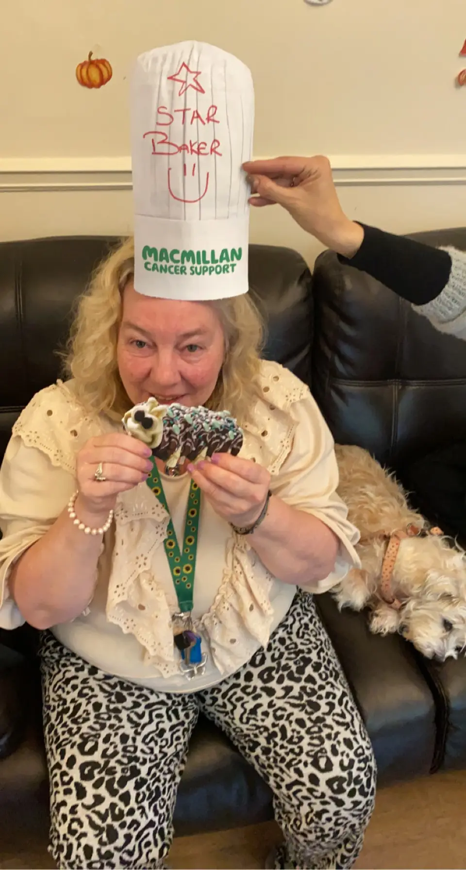 resident with paper hat reading "star baker"