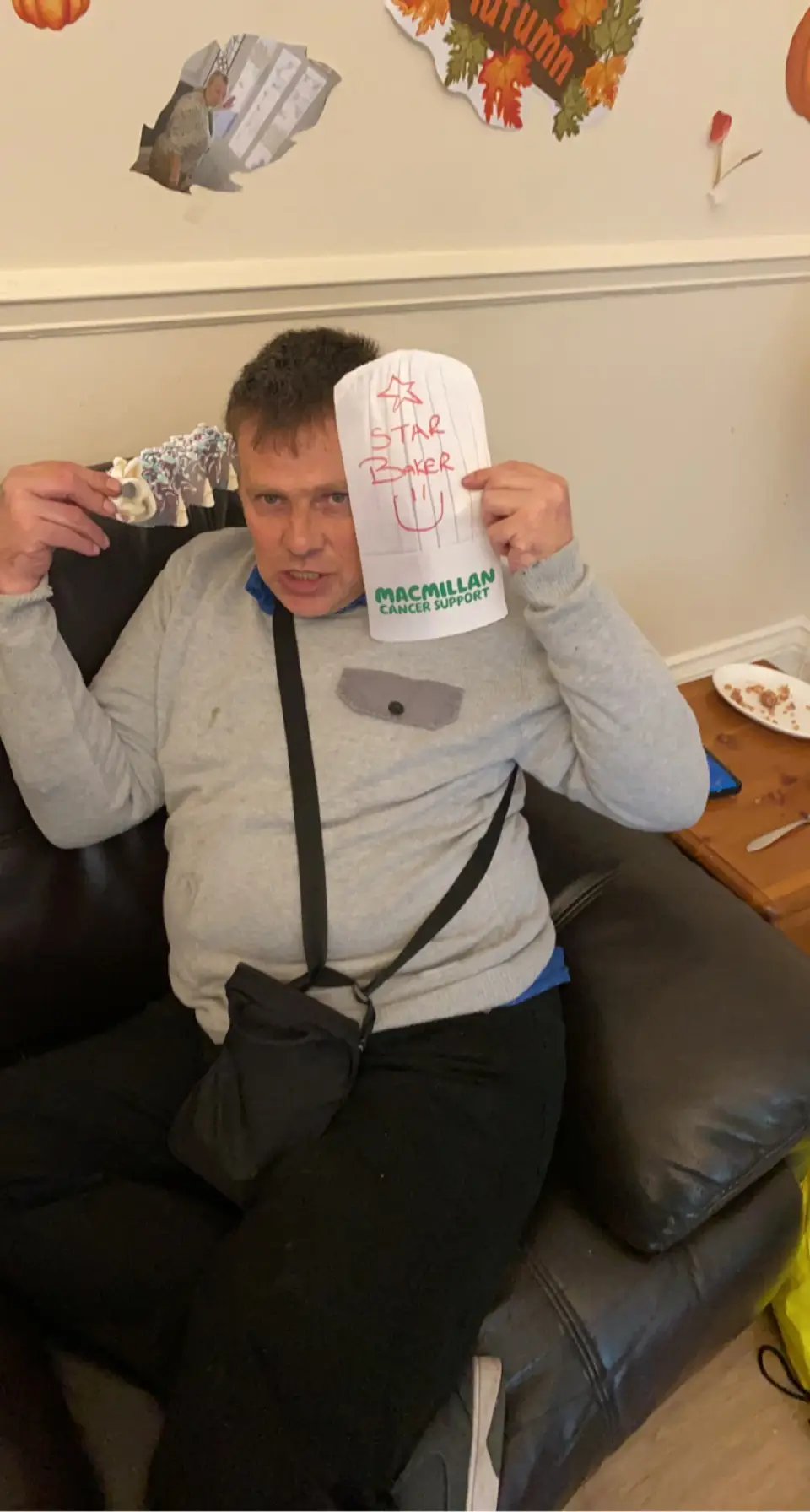 resident with paper hat reading "star baker"