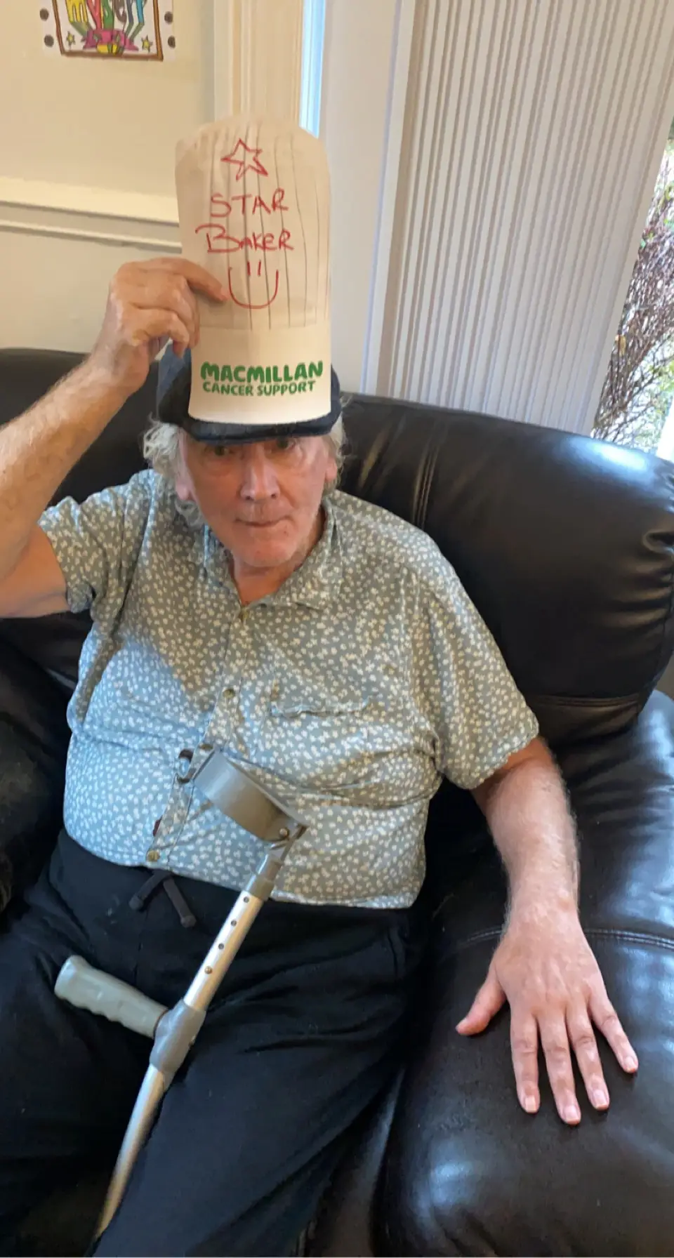 resident with paper hat reading "star baker"