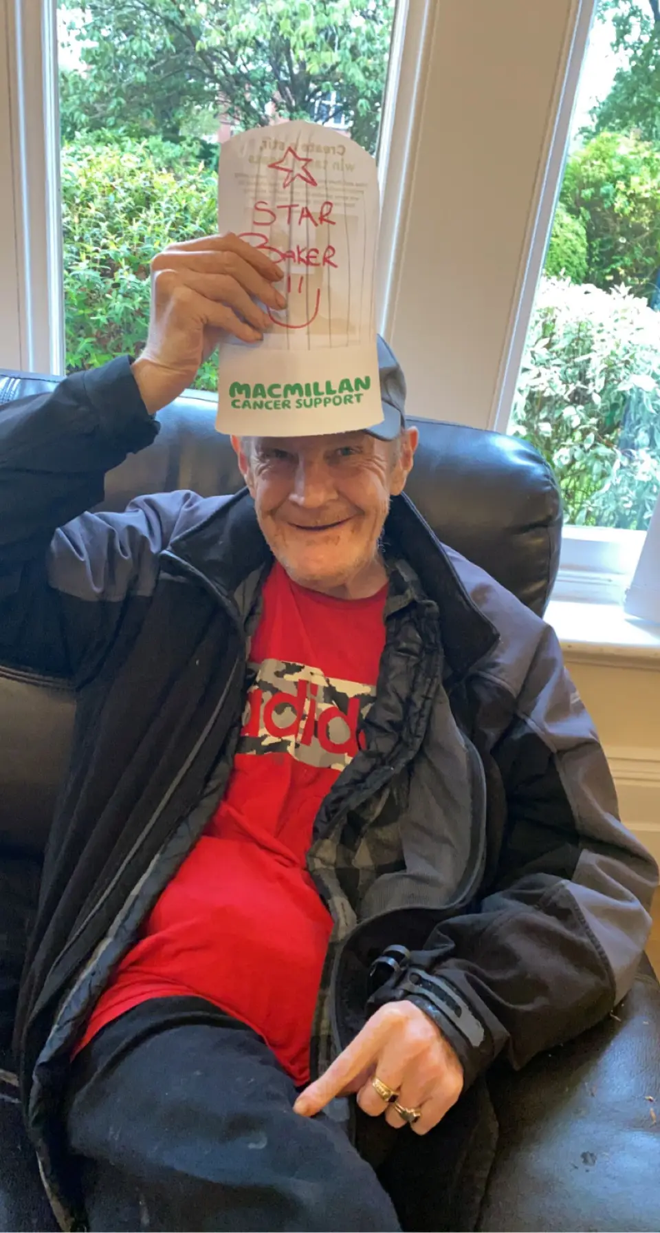 resident with paper hat reading "star baker"