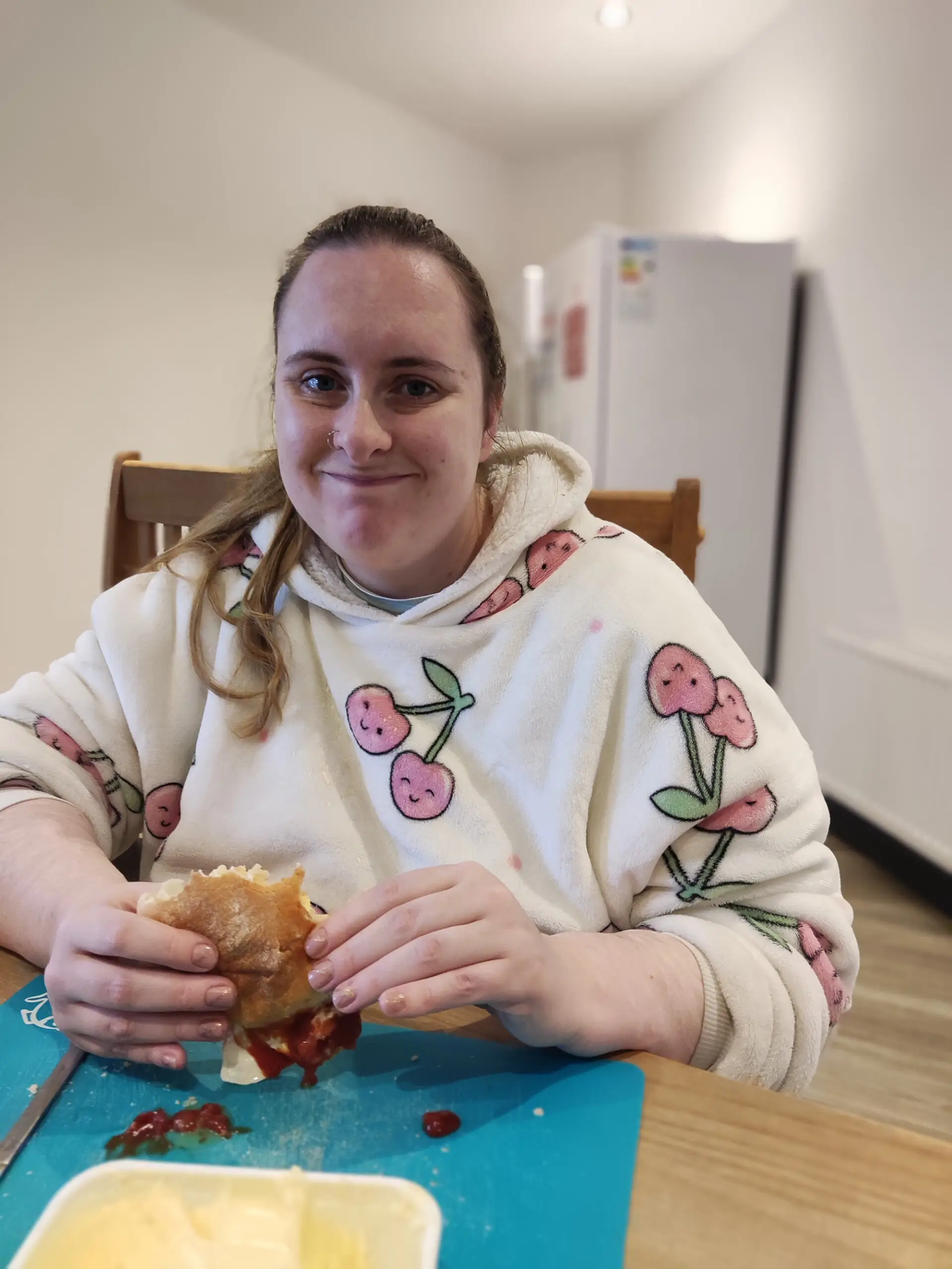 resident eating bacon butty