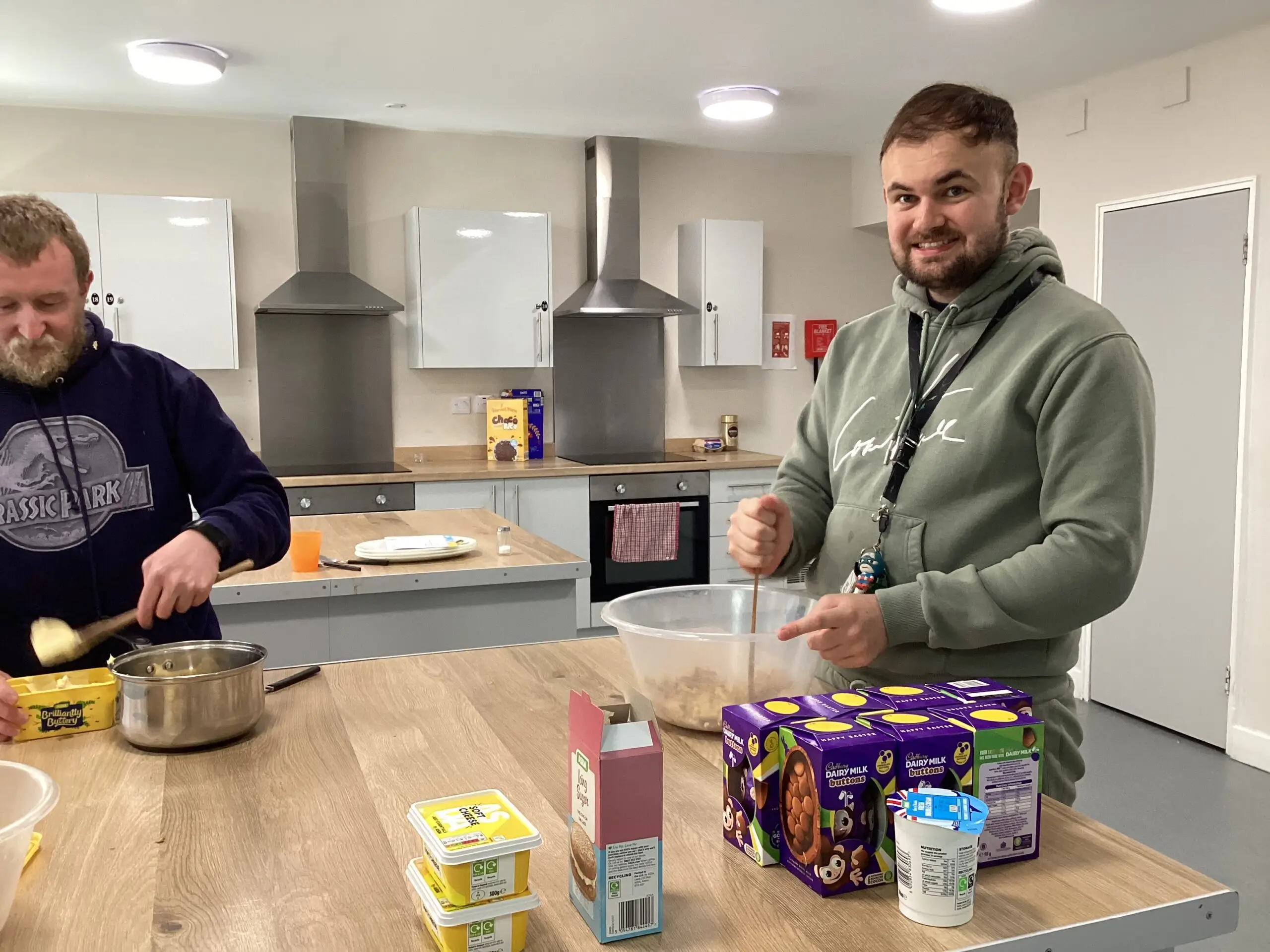 Resident filling an Easter egg with cheesecake mix