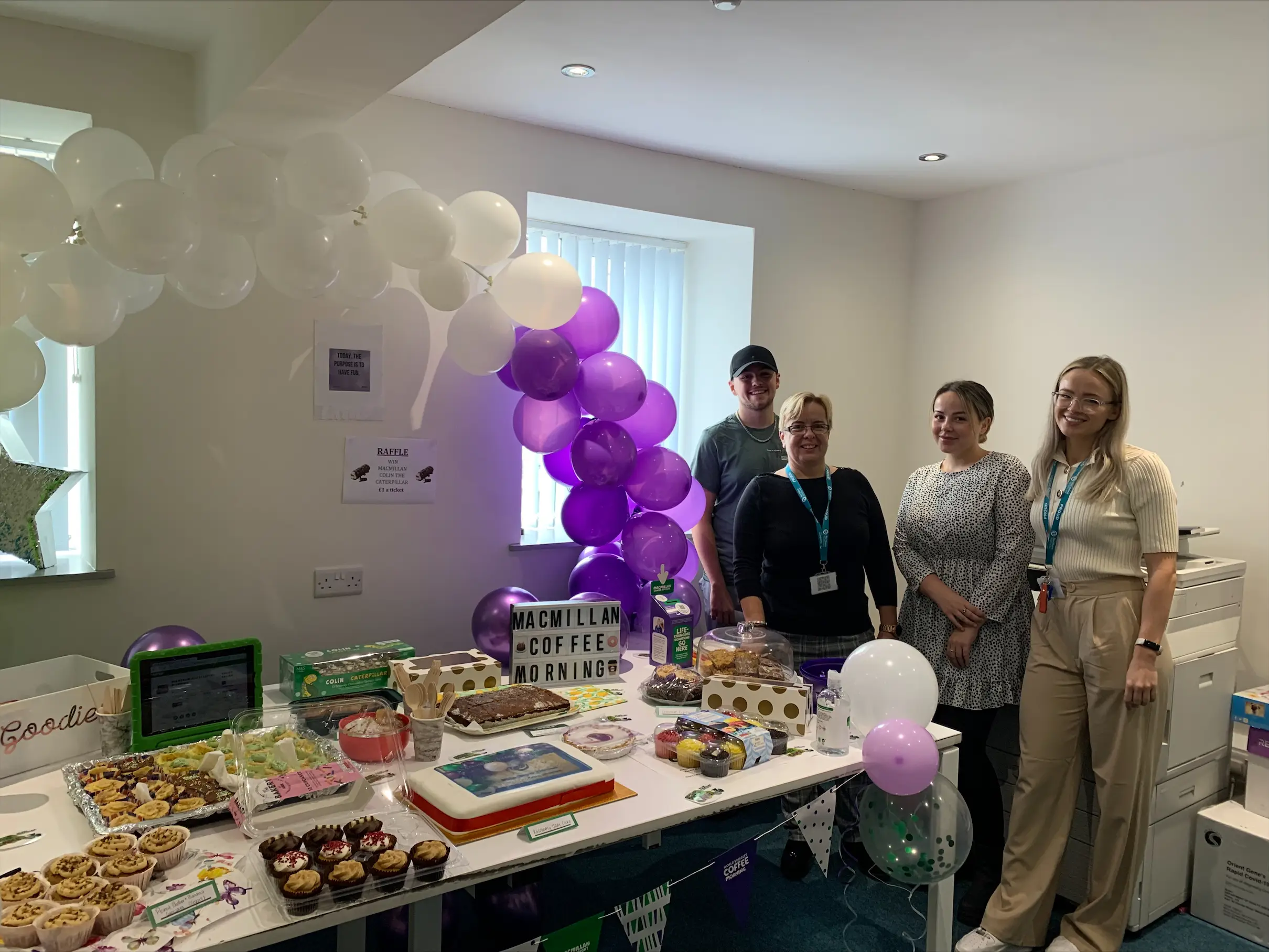 team members with buffet table