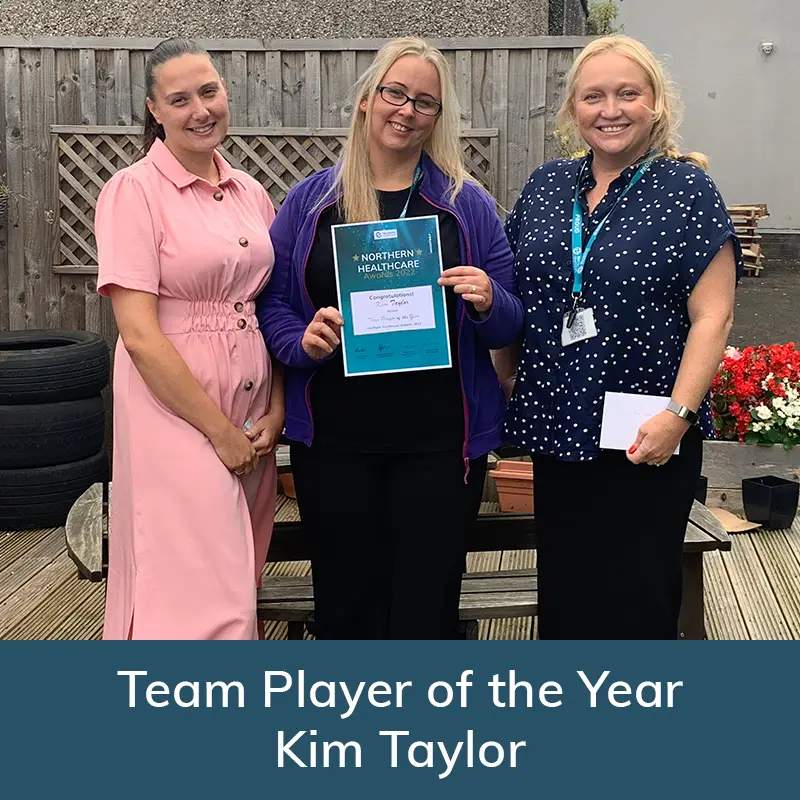 Kim Taylor receiving her award