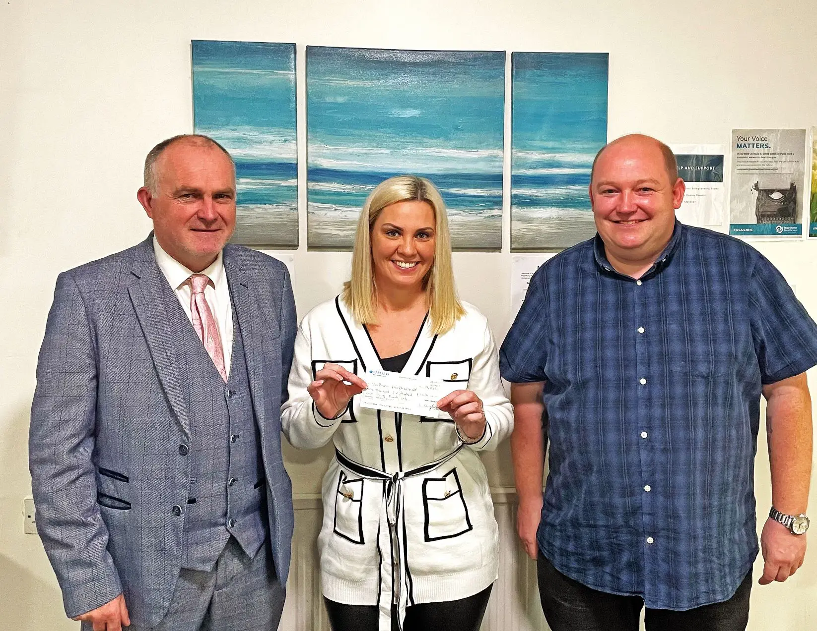Sponsored Swimmer Presents Cheque to NHC Representatives