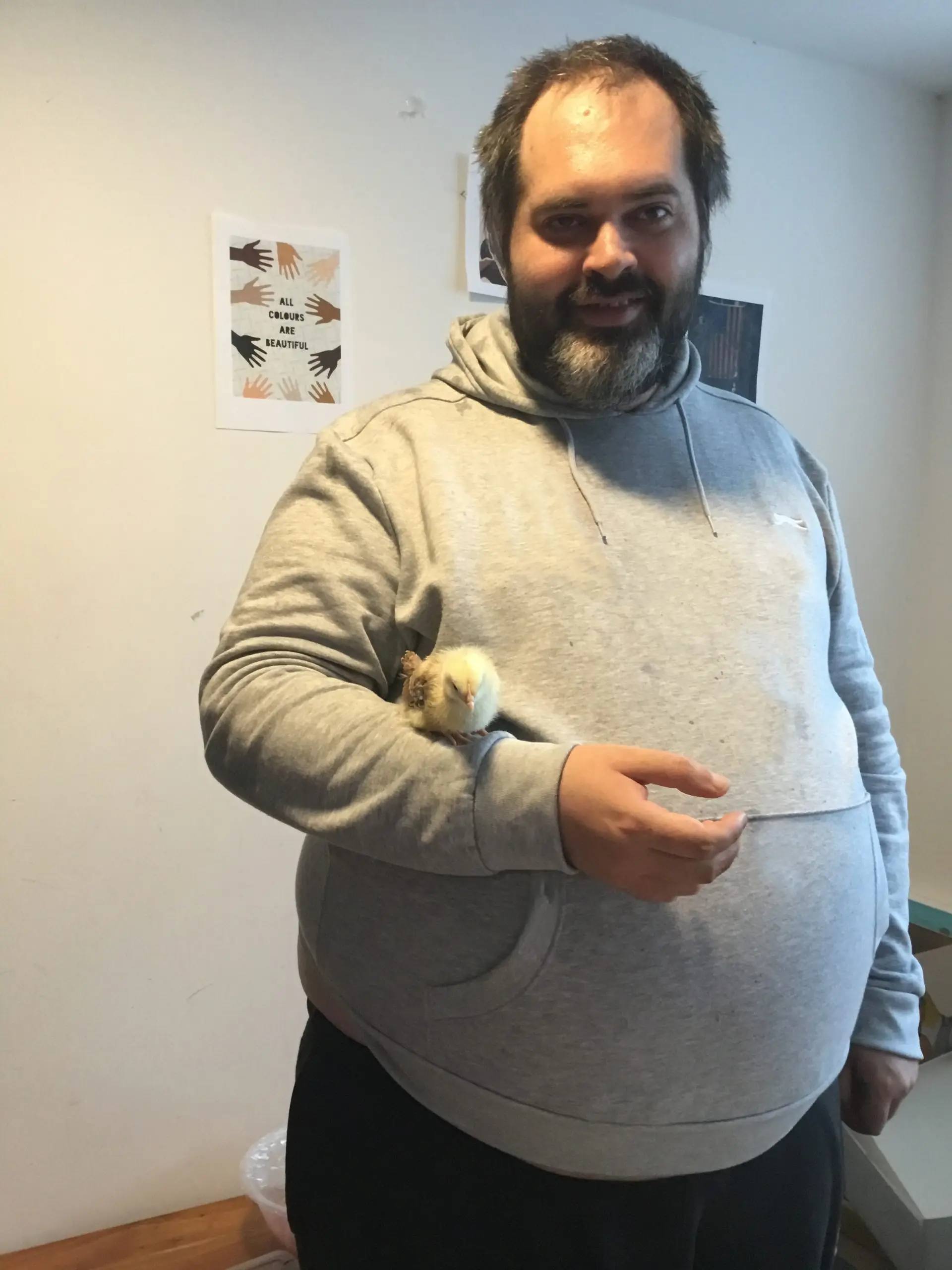 resident holding a chick