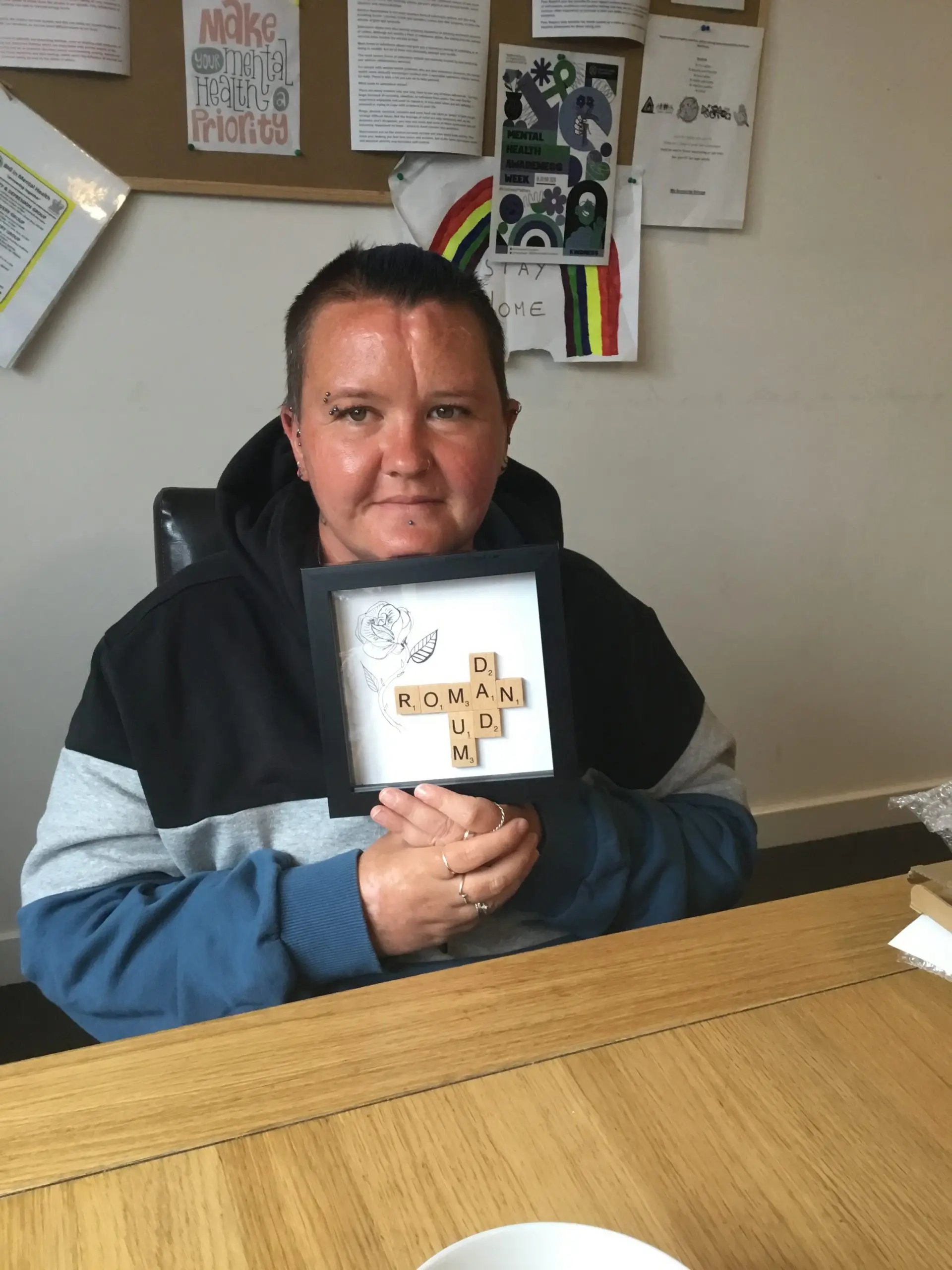 resident holding handmade personalised frame