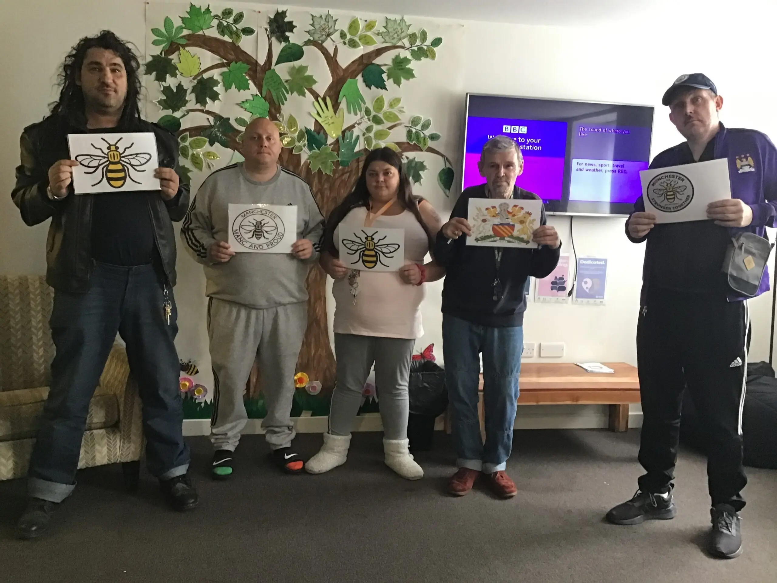 group of people holding posters