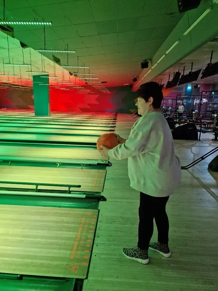 A resident enjoying a game of bowling