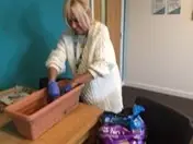 Staff planting tomato seeds