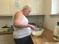 Resident mixing up a batch of scones