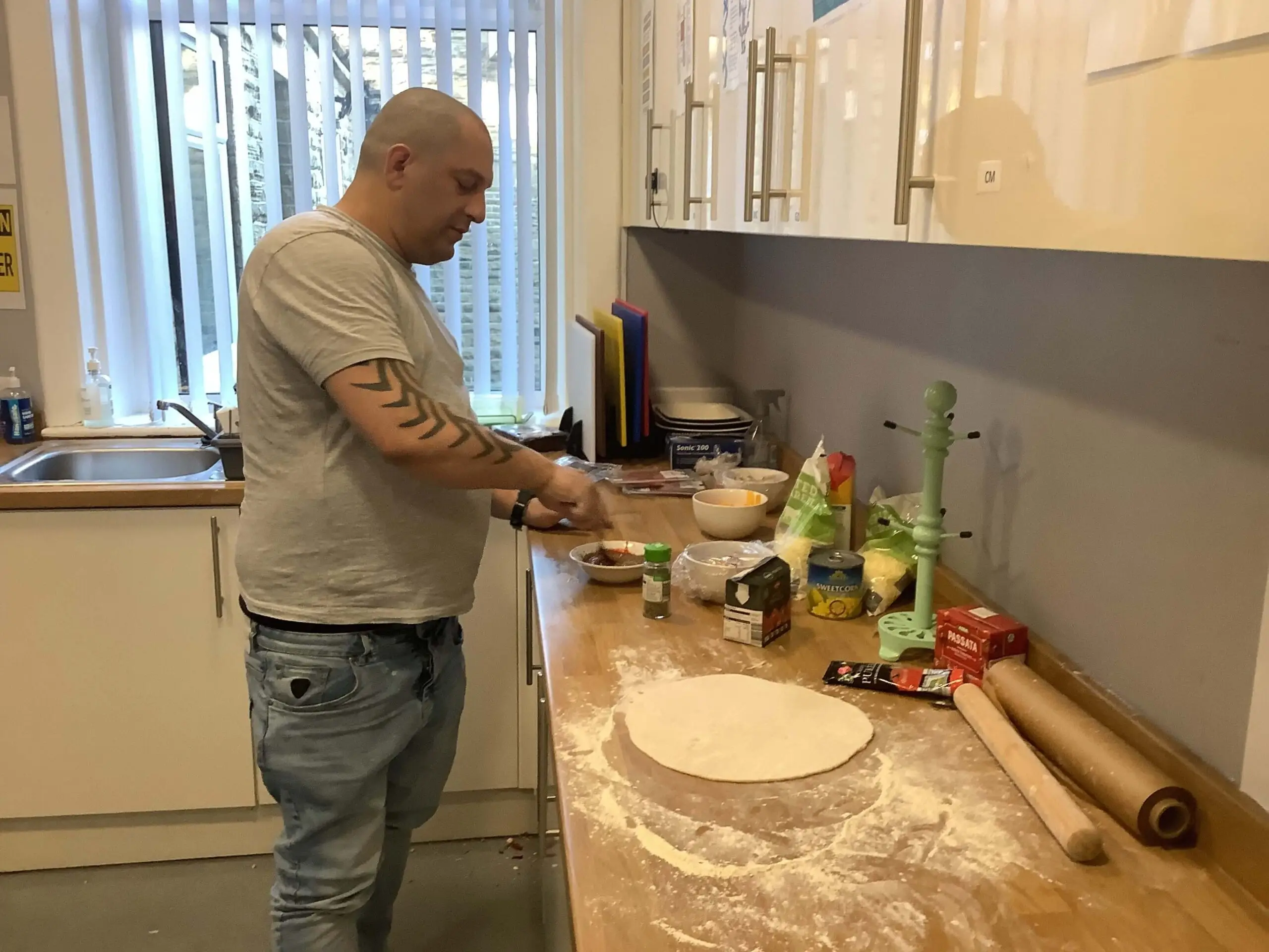 resident with pizza dough