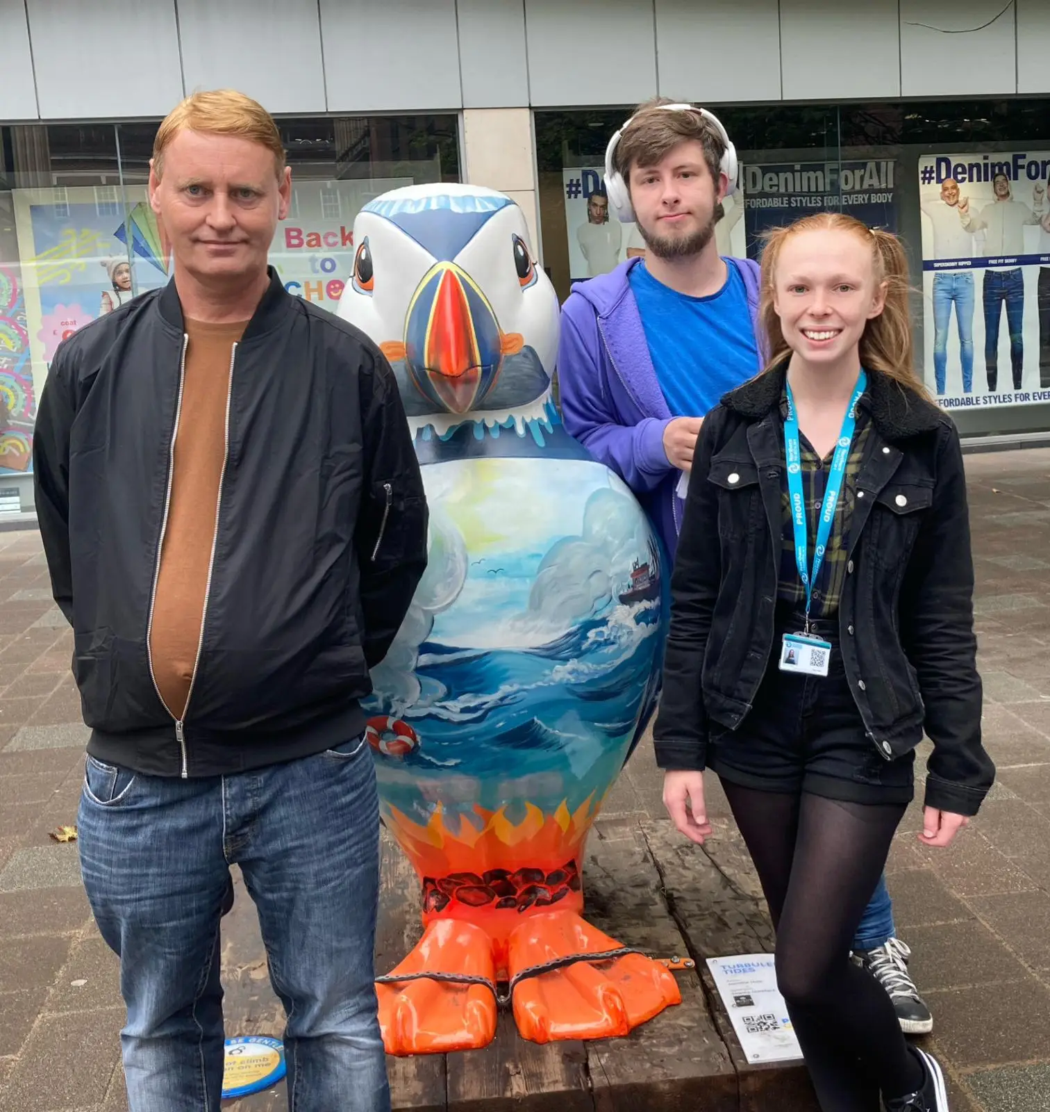 residents with puffin statue
