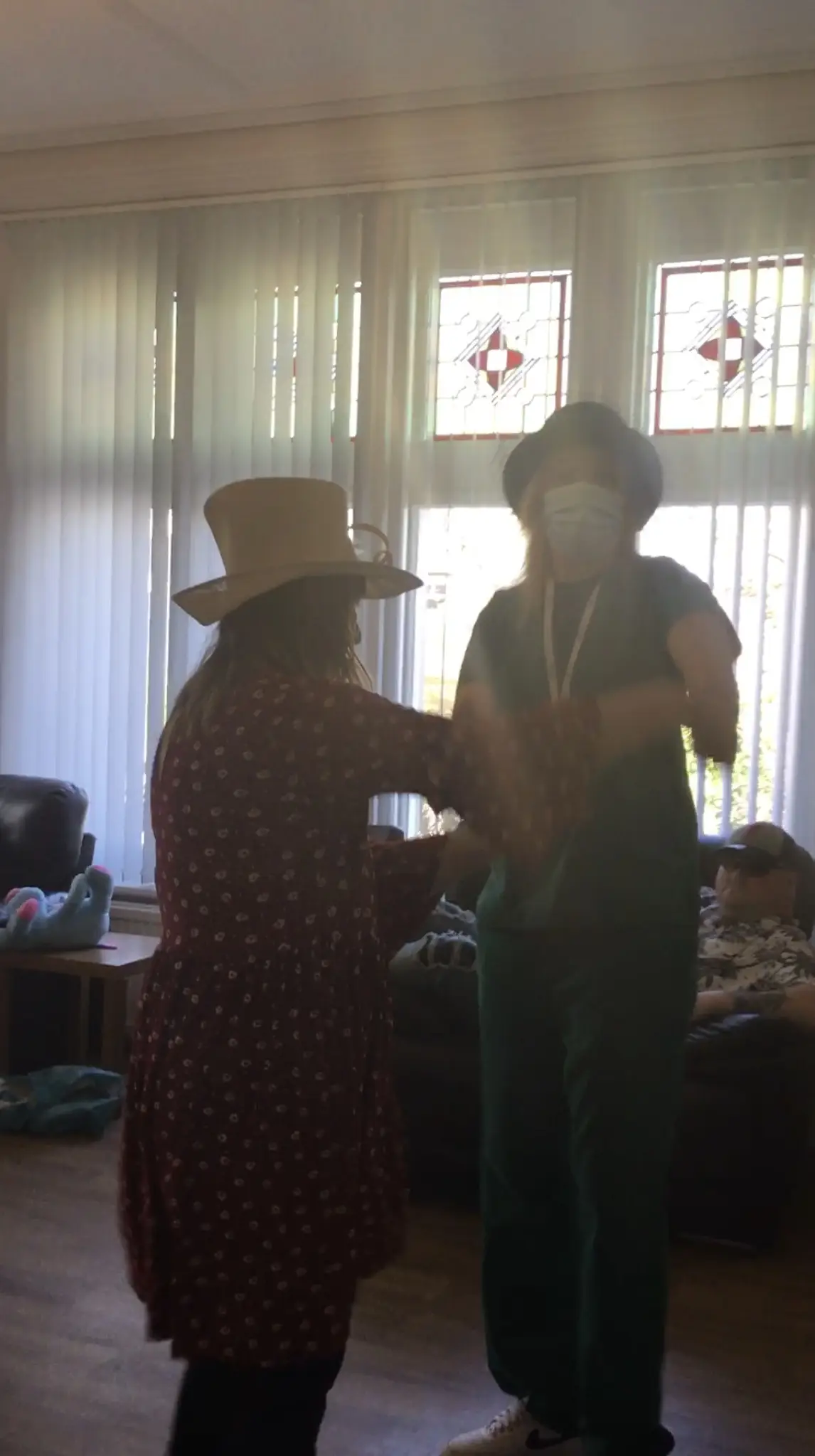 resident and team member dancing