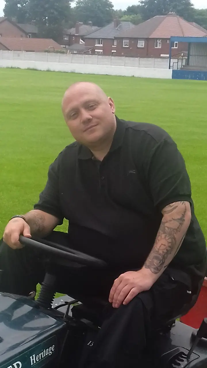 male on ride on lawnmower