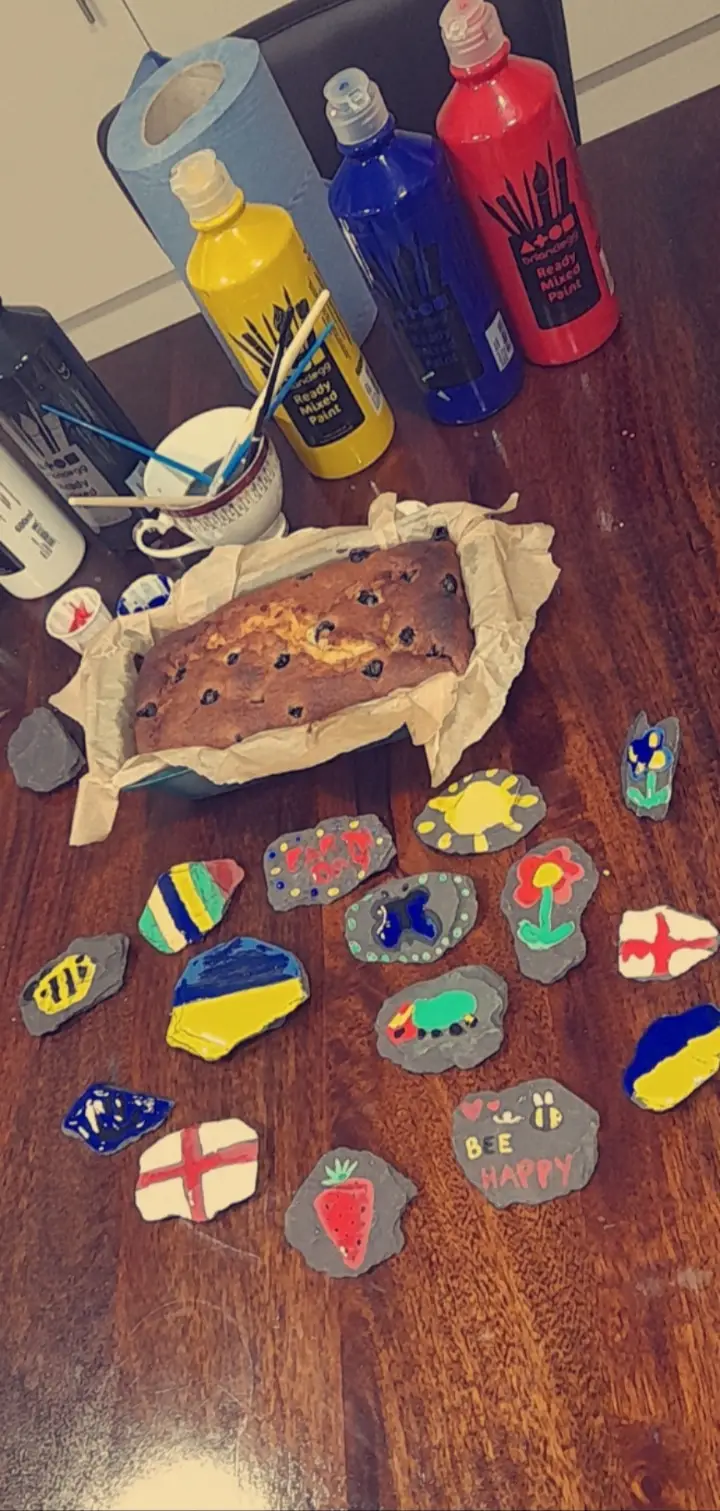 home made loaf cake and rock paintings
