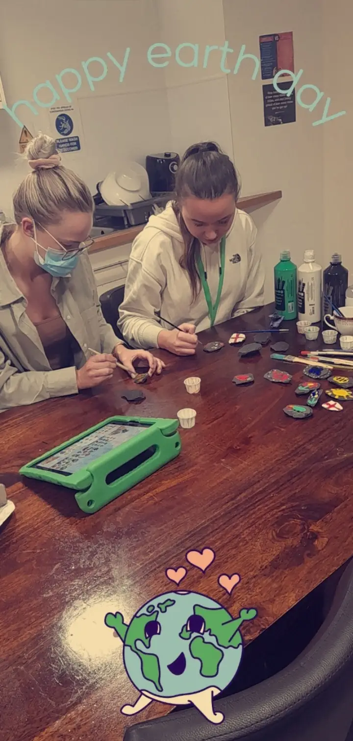 residents painting rocks