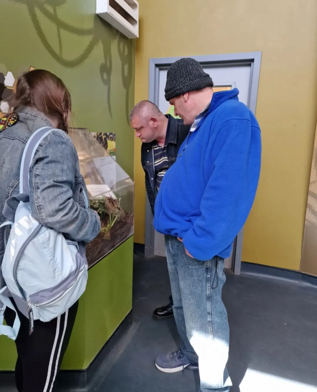 residents looking at museum display