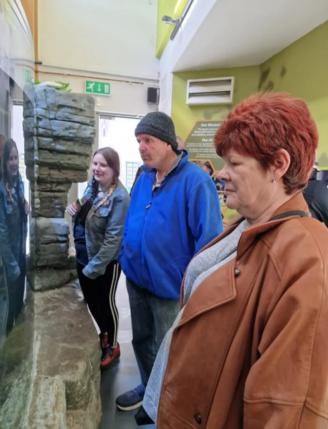 residents looking at museum display