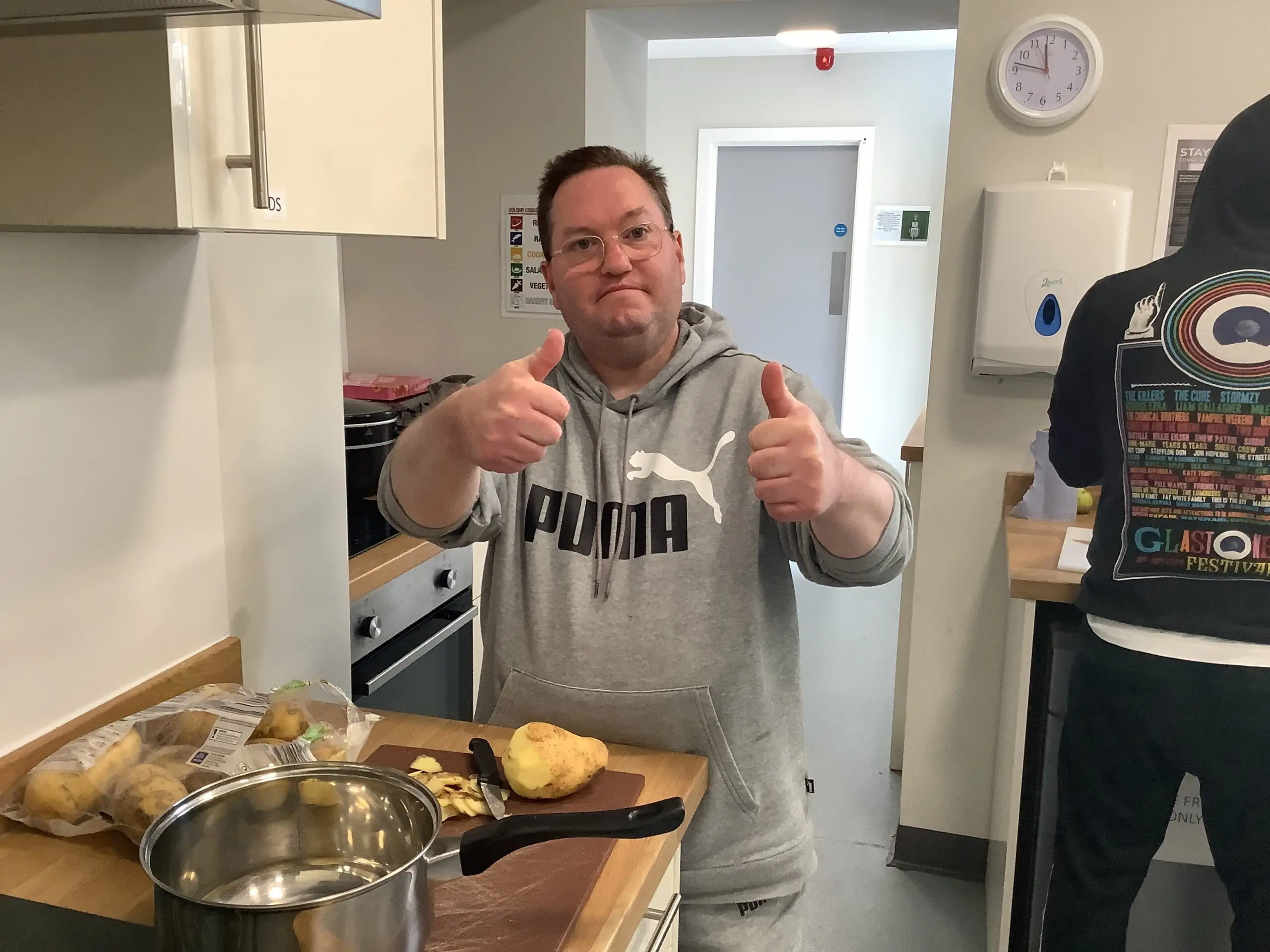 male resident with thumbs up