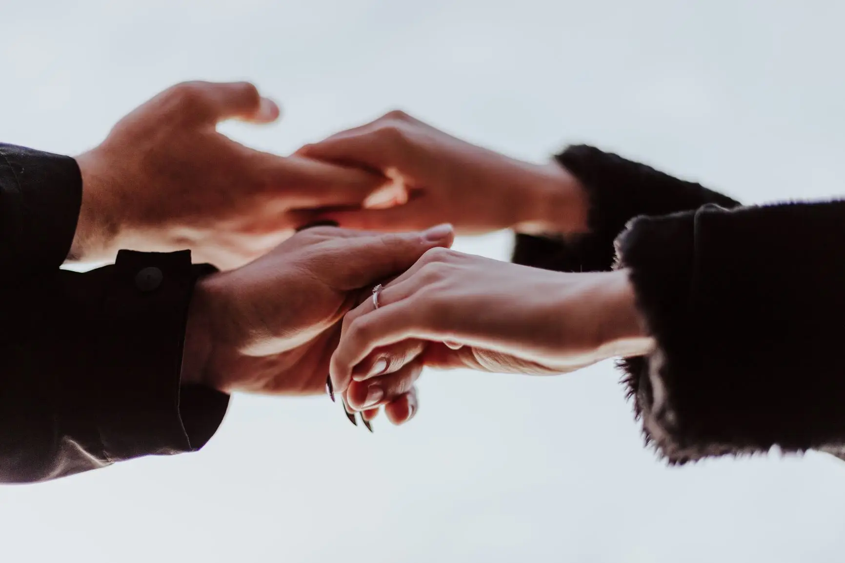 Two people touching hands