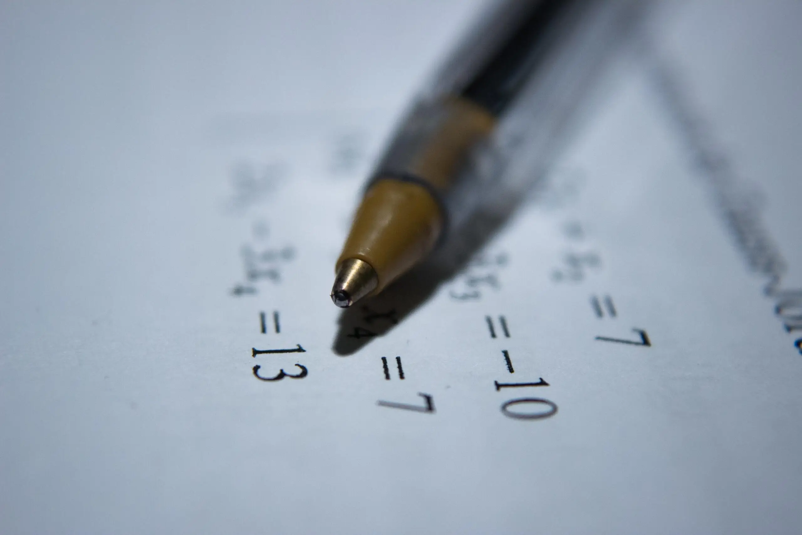 dyscalculia: pen on paper with maths equations