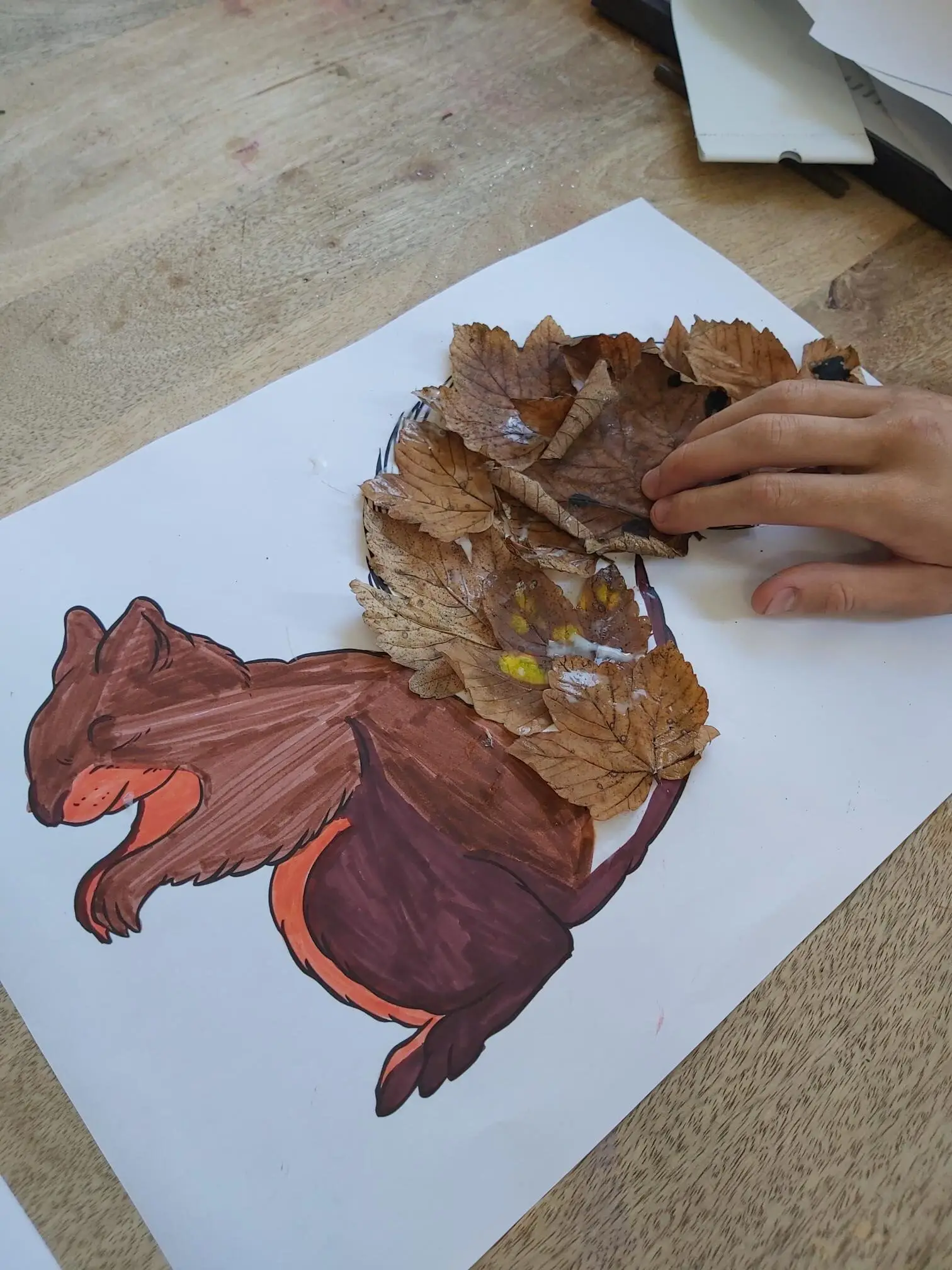 squirrel drawing with autumn leaves forming the tail