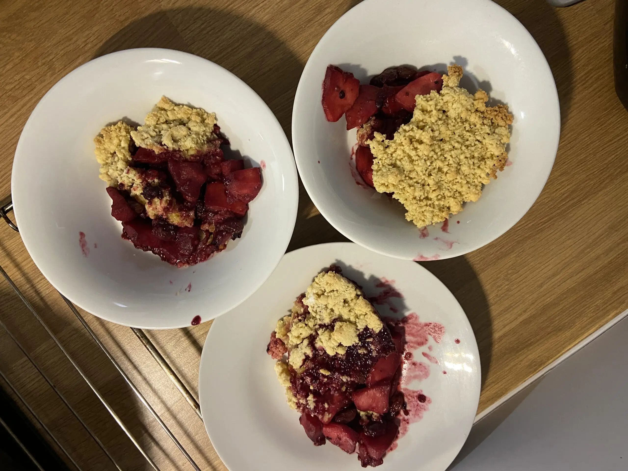 3 dishes of home made blackberry crumble