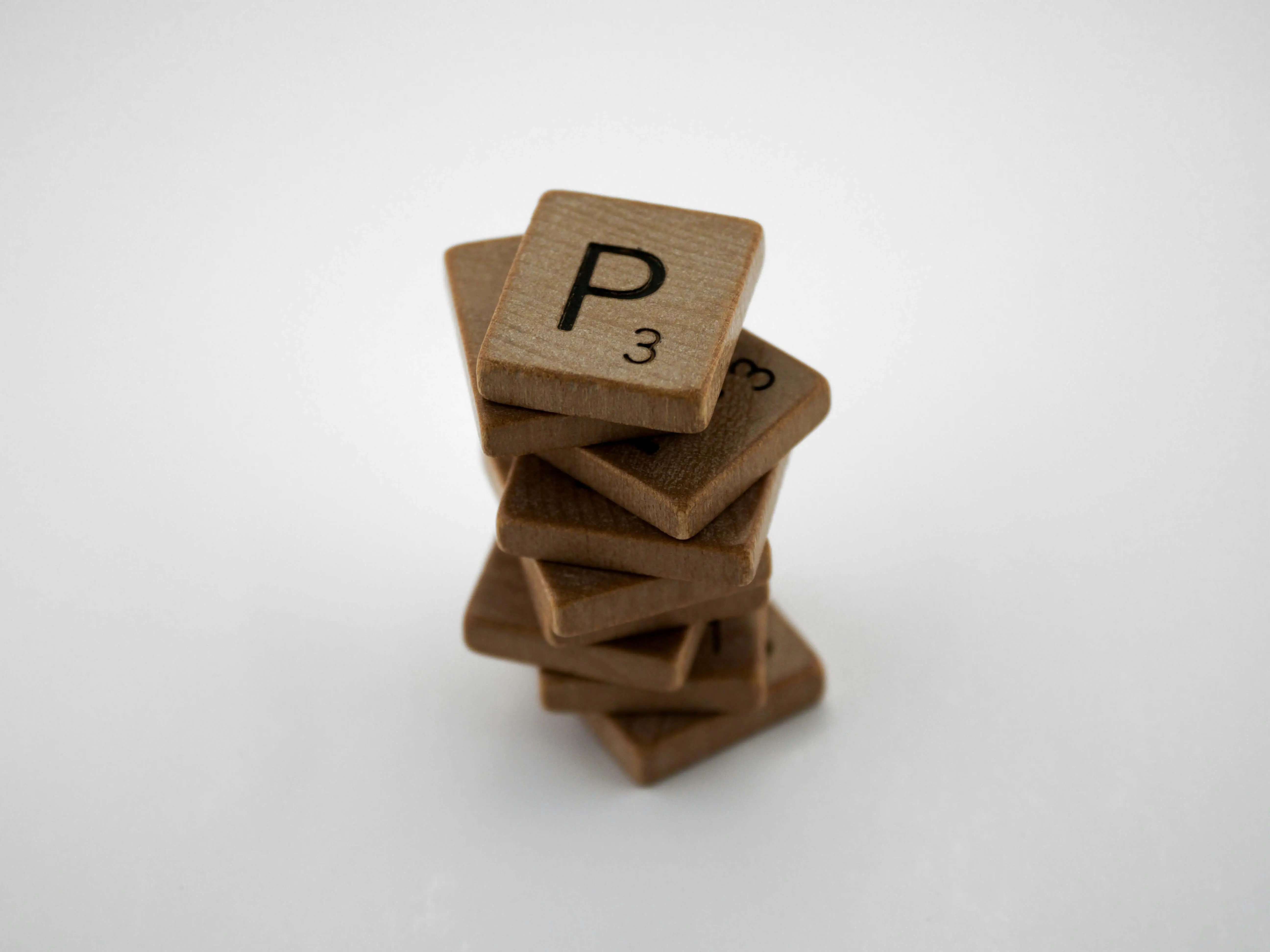 A tower of Scrabble letter tiles representing the 5 Ps formulation.