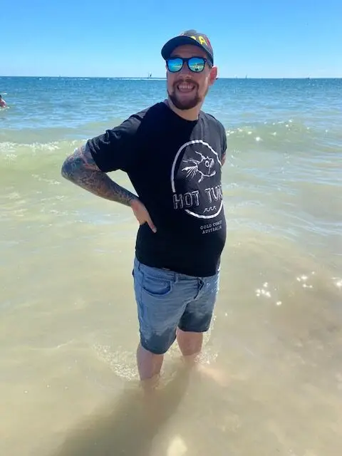 resident ankle deep in the sea